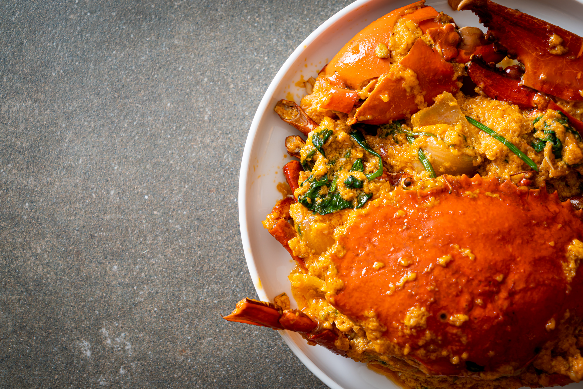 Overhead flat-lay of all ingredients for Nigerian Egusi Stew with Pumpkin Leaves and Crayfish laid out on a kitchen surface.