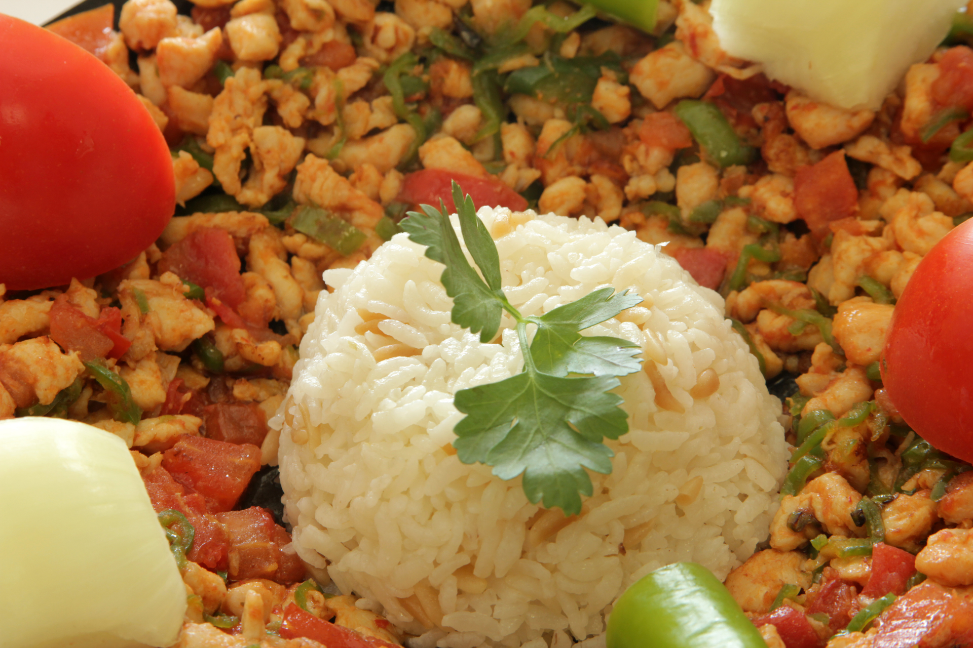Overhead flat-lay of all ingredients for Nigerian Suya-Spiced Cauliflower Rice with Peanut Sauce laid out on a kitchen surface.