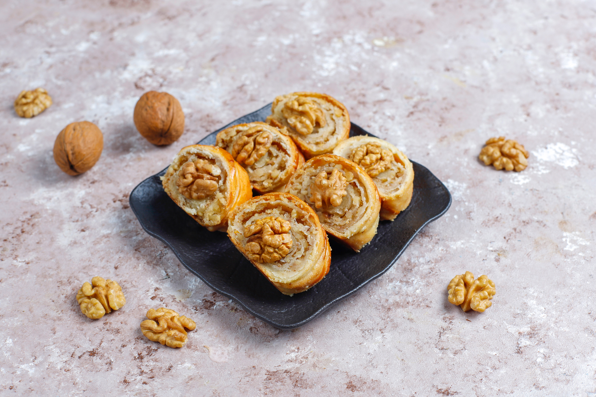 Overhead flat-lay of all ingredients for Nutty Armenian Gata Pastry with Walnut Filling laid out on a kitchen surface.