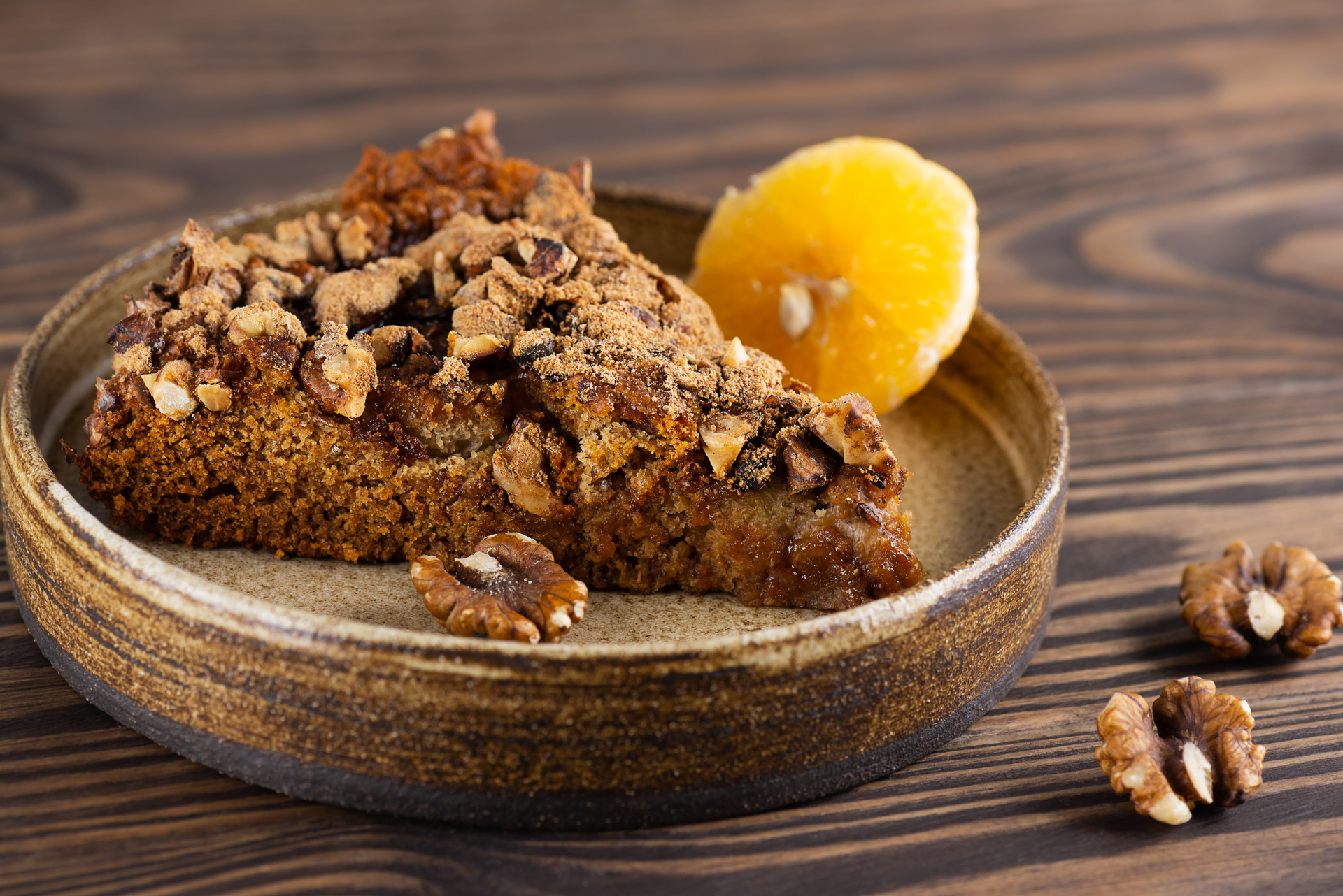Overhead flat-lay of all ingredients for Nutty Greek Walnut Cake with Orange Blossom Glaze laid out on a kitchen surface.