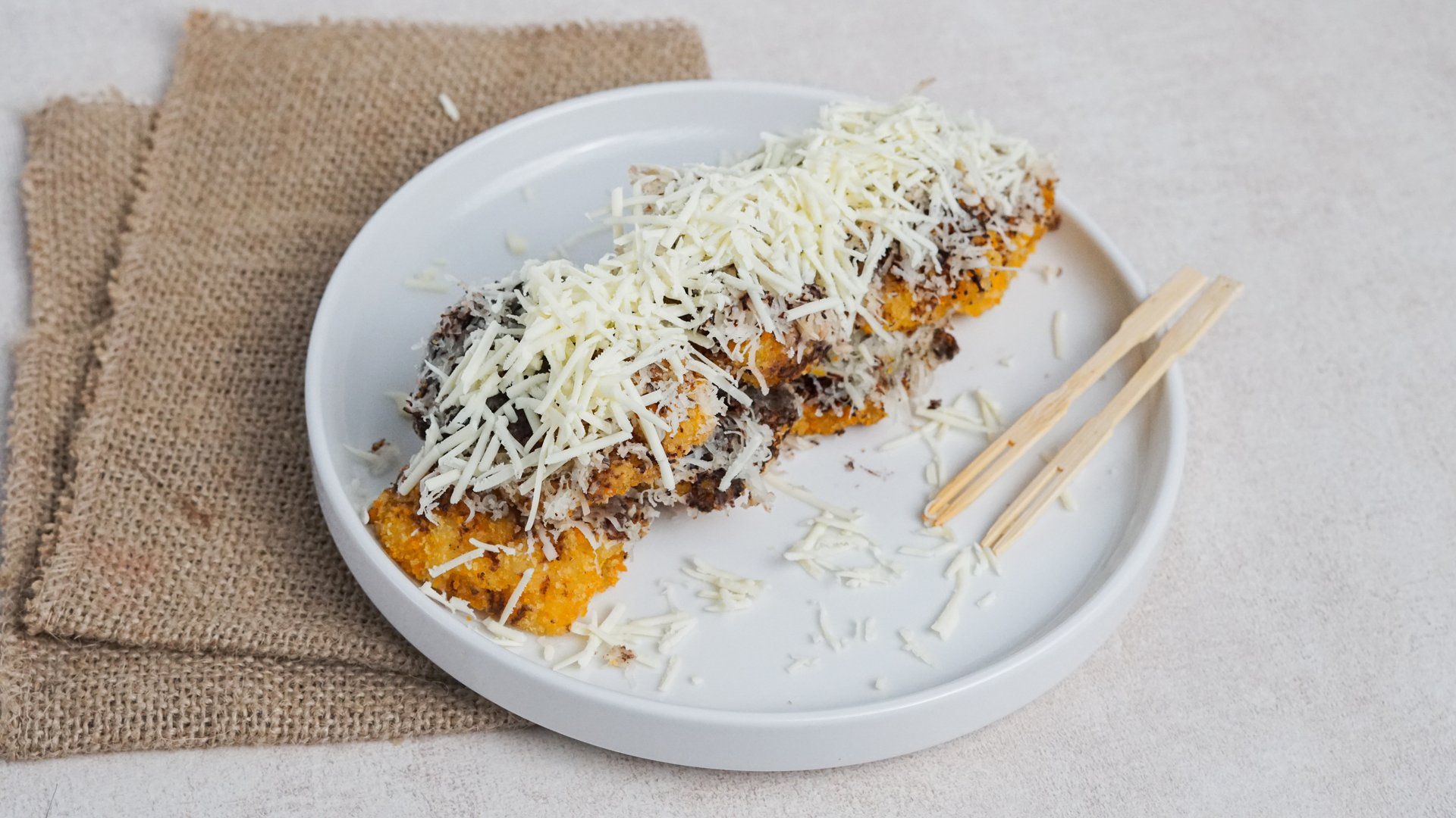 Overhead flat-lay of all ingredients for Okonomiyaki-Flavored Croquettes with Savory Katsu Sauce laid out on a kitchen surface.