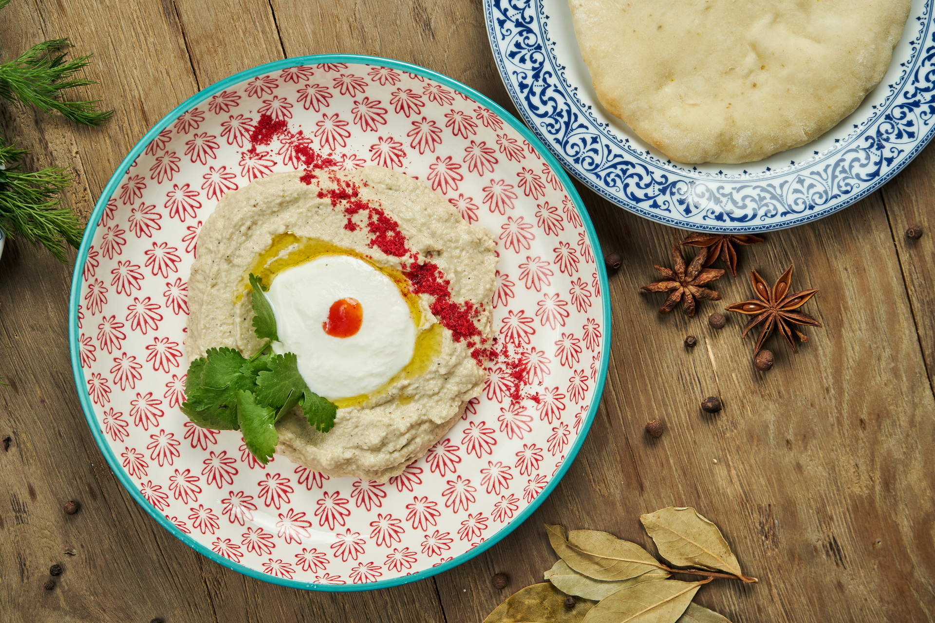 Overhead flat-lay of all ingredients for Palestinian Maqluba with Eggplant and Yogurt Sauce laid out on a kitchen surface.