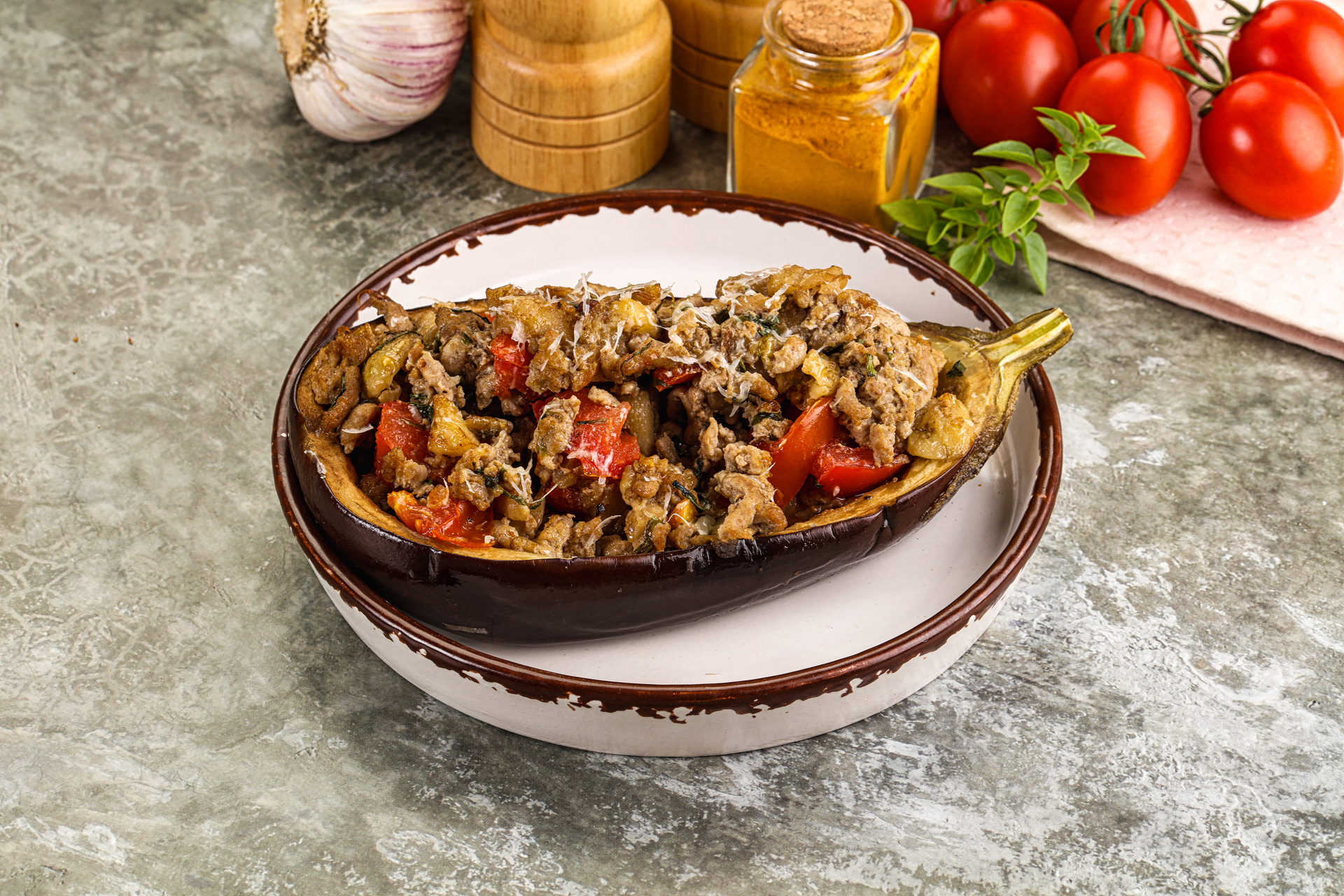 Overhead flat-lay of all ingredients for Persian Eggplant Fesenjan with Pomegranate and Walnuts laid out on a kitchen surface.