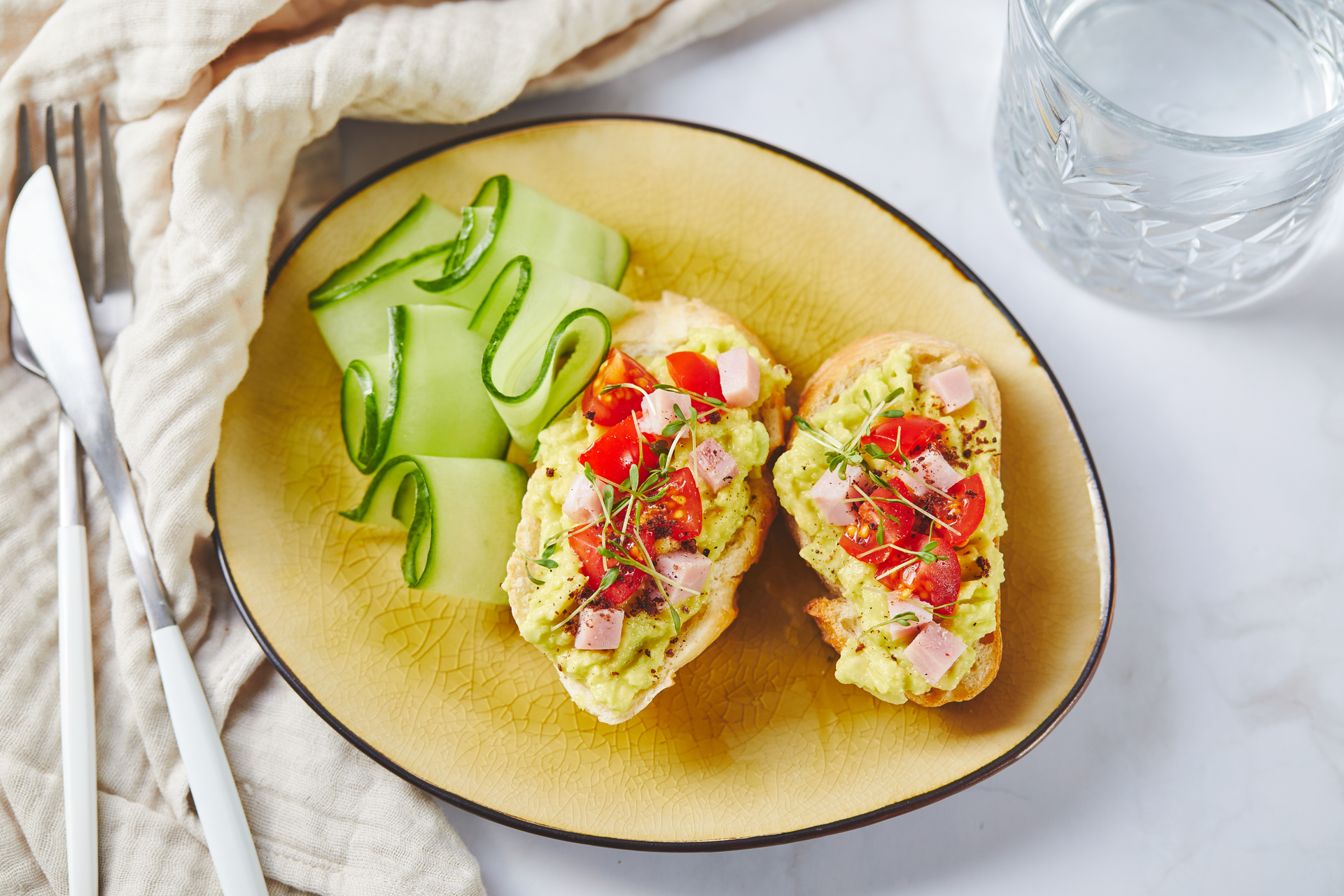 Overhead flat-lay of all ingredients for Peruvian Causa Limeña with Quail Eggs and Tomato laid out on a kitchen surface.