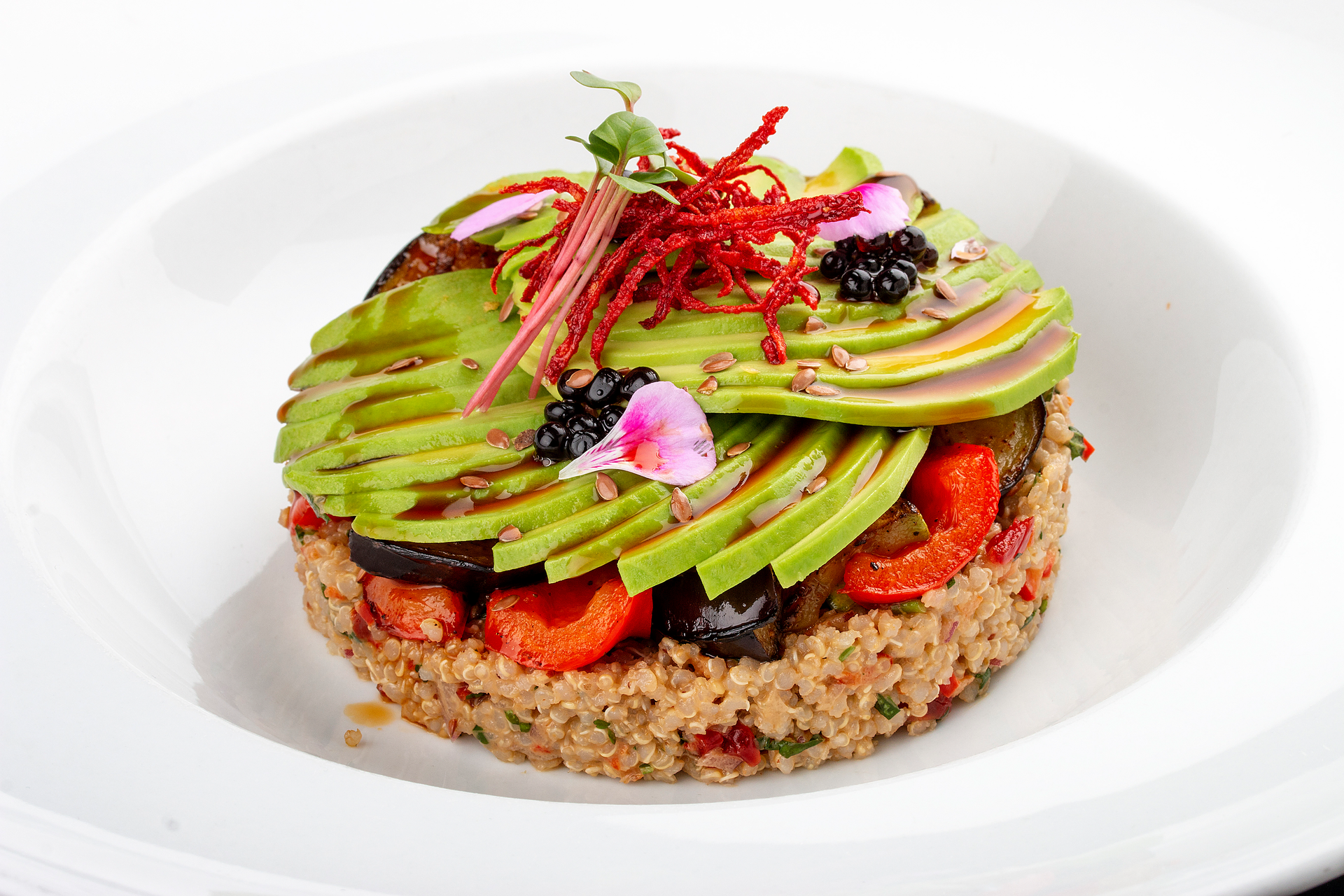 Overhead flat-lay of all ingredients for Peruvian Quinoa and Avocado Tartare with Lime Dressing laid out on a kitchen surface.