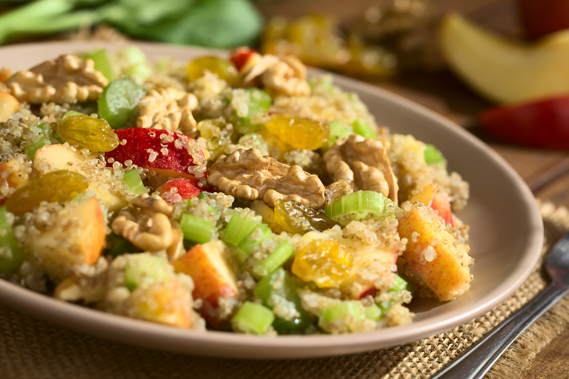 Overhead flat-lay of all ingredients for Peruvian Quinoa Salad with Roasted Corn and Avocado laid out on a kitchen surface.