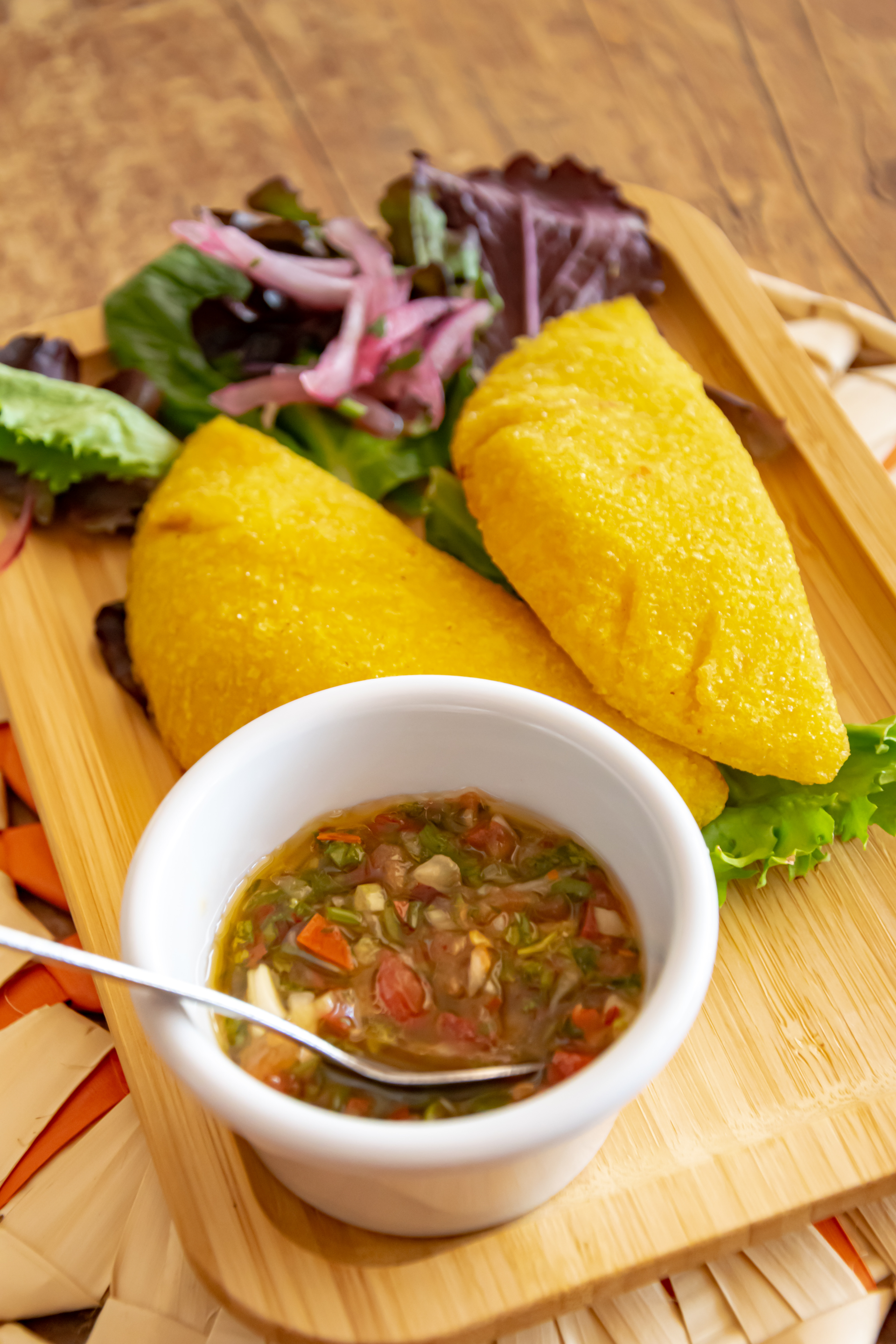 Piquant Bolivian Sajta de Pollo with Aji Amarillo — Main Course served and photographed from above