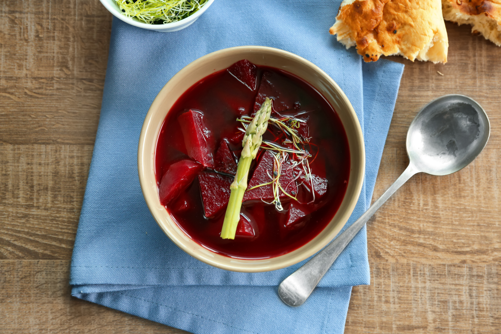 Overhead flat-lay of all ingredients for Polish Czernina with Duck Blood and Spices laid out on a kitchen surface.