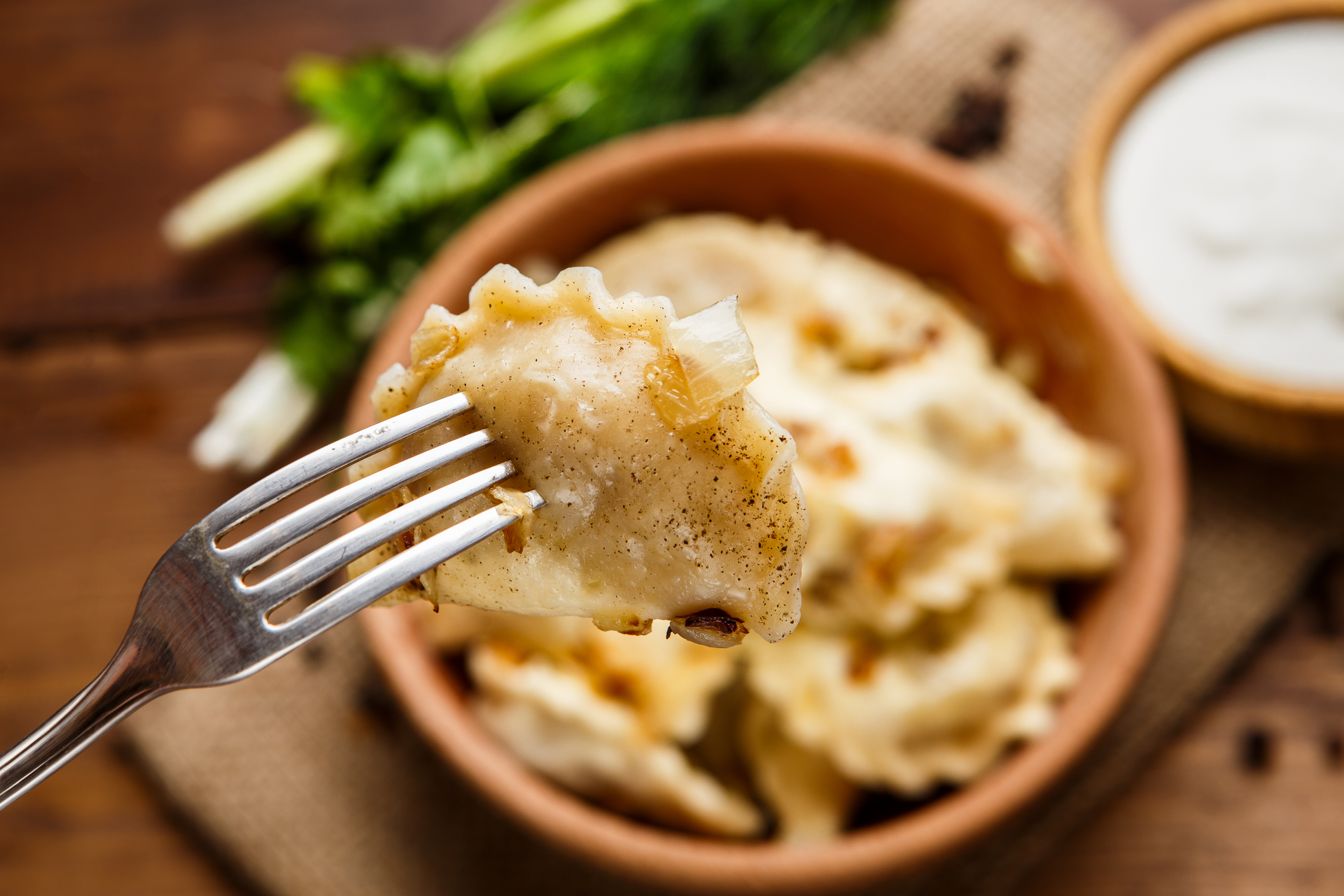 Overhead flat-lay of all ingredients for Polish Pierogi with Potato and Cheese Filling laid out on a kitchen surface.