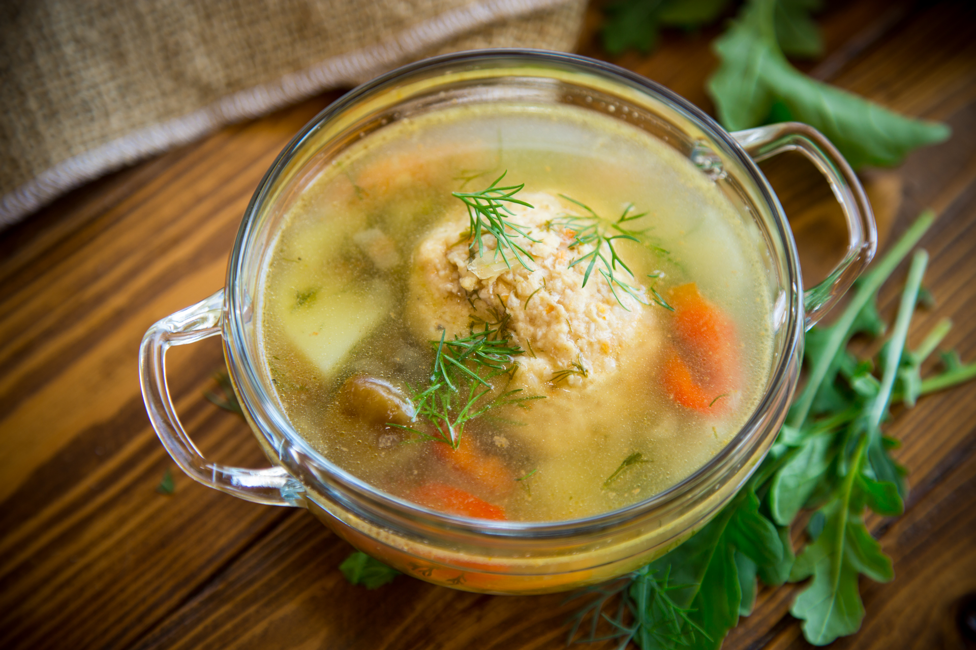 Overhead flat-lay of all ingredients for Polish Rosół with Chicken and Parsley laid out on a kitchen surface.