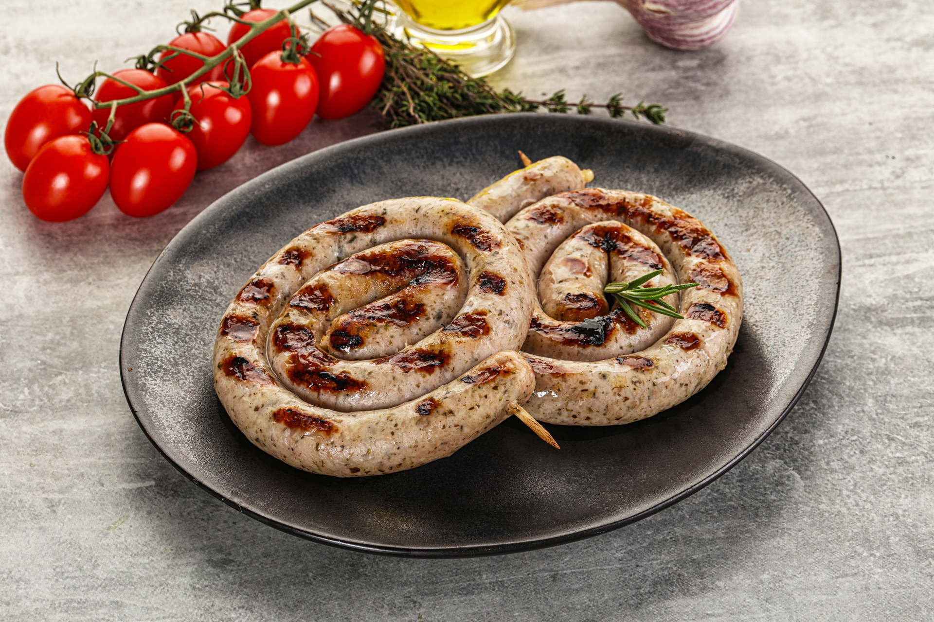 Portuguese Alheira Sausage Roulade with Olives and Peppers — Main Course served and photographed from above