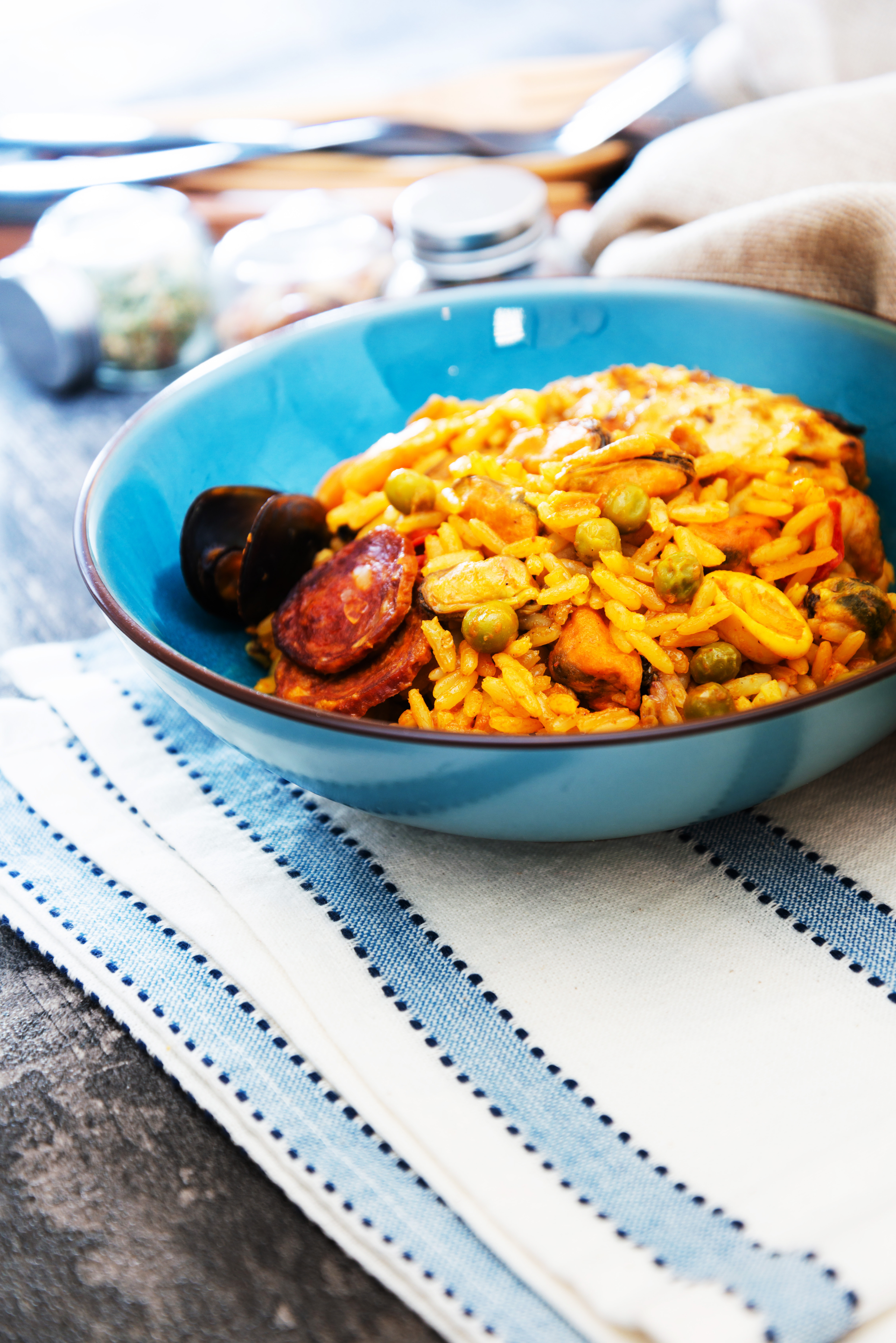 Overhead flat-lay of all ingredients for Portuguese Arroz de Pato with Chorizo and Orange Zest laid out on a kitchen surface.