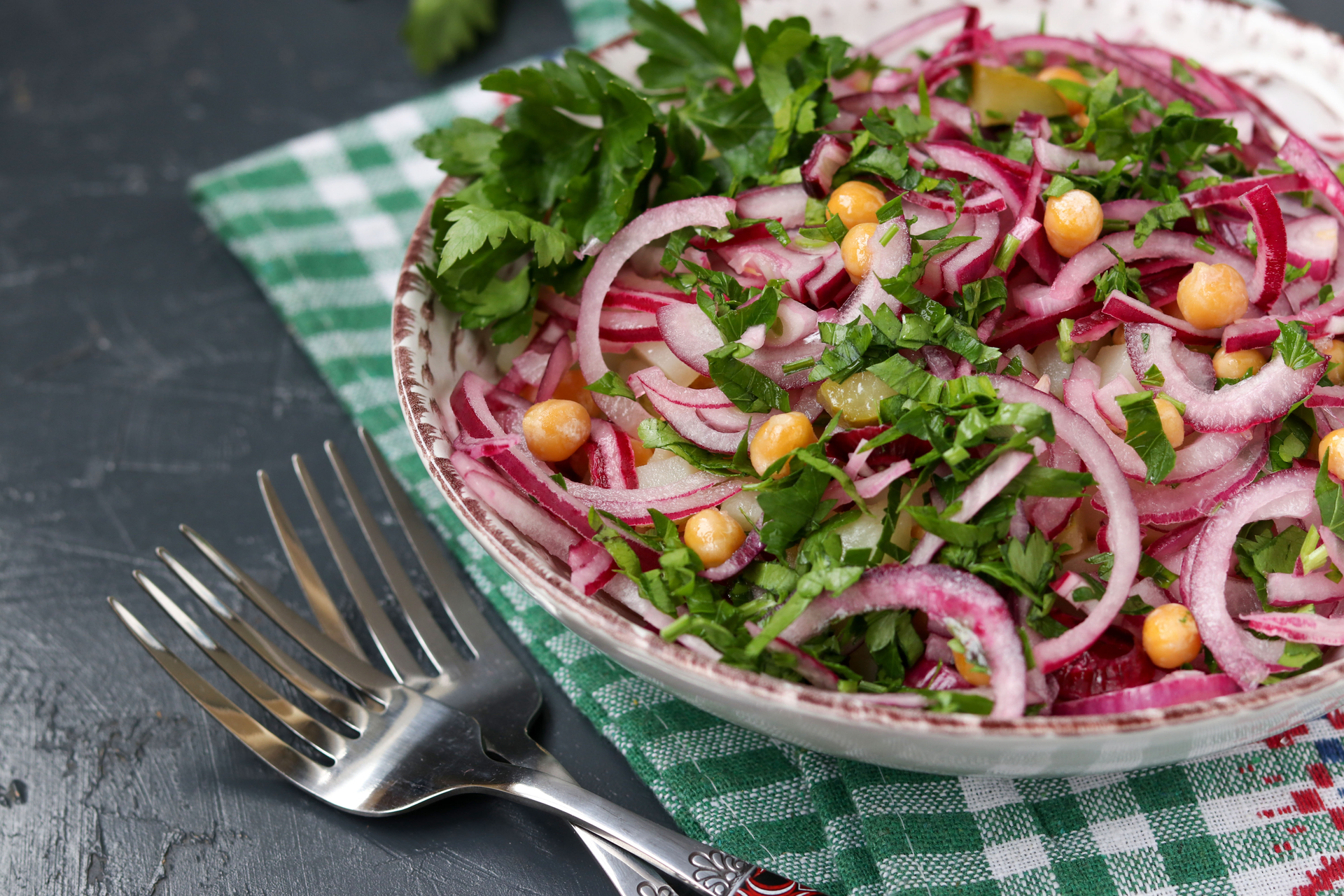 Overhead flat-lay of all ingredients for Refreshing Indian Kachumber Salad with Lime and Cumin laid out on a kitchen surface.