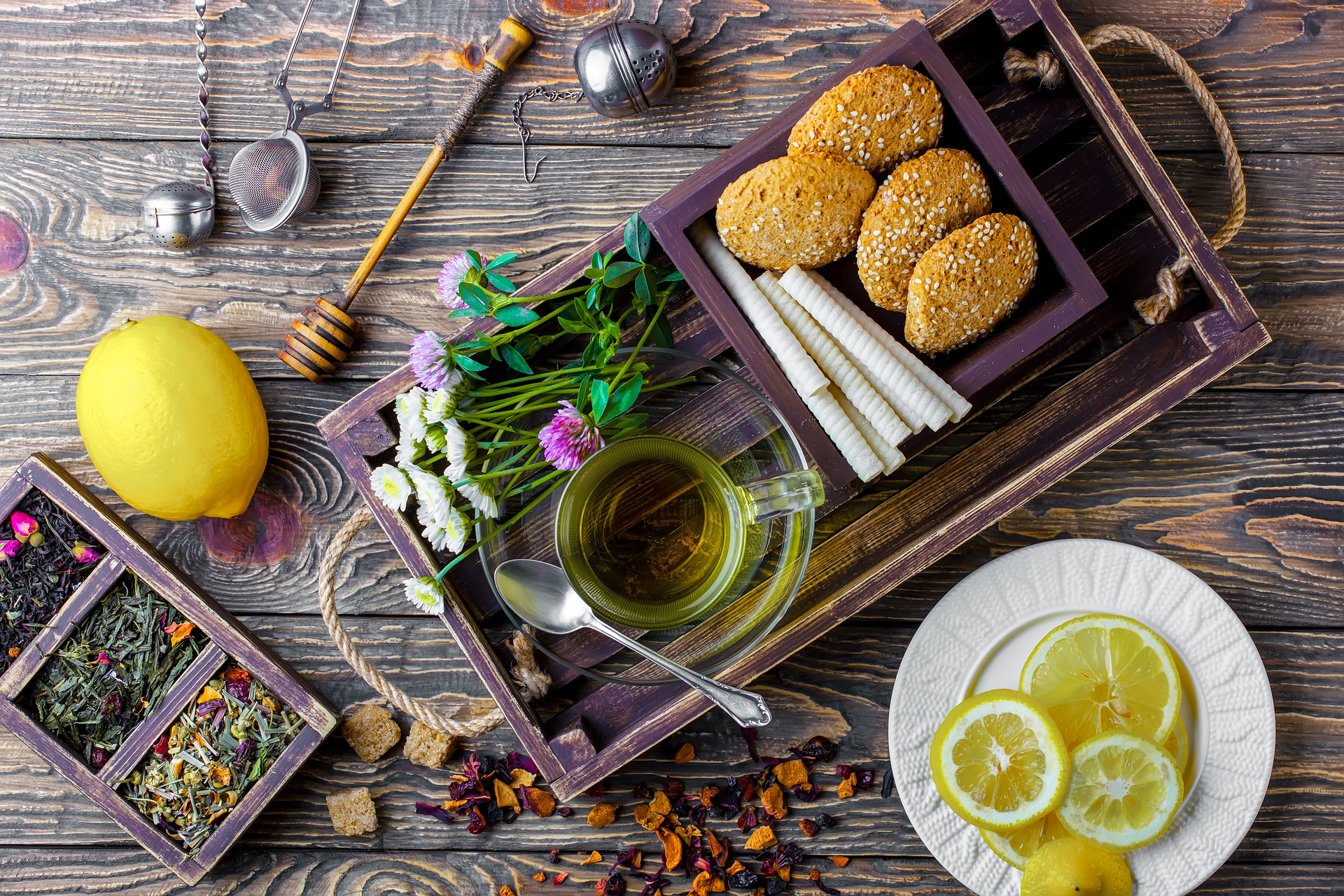 Overhead flat-lay of all ingredients for Refreshing Moroccan Mint Tea with Orange Blossoms laid out on a kitchen surface.