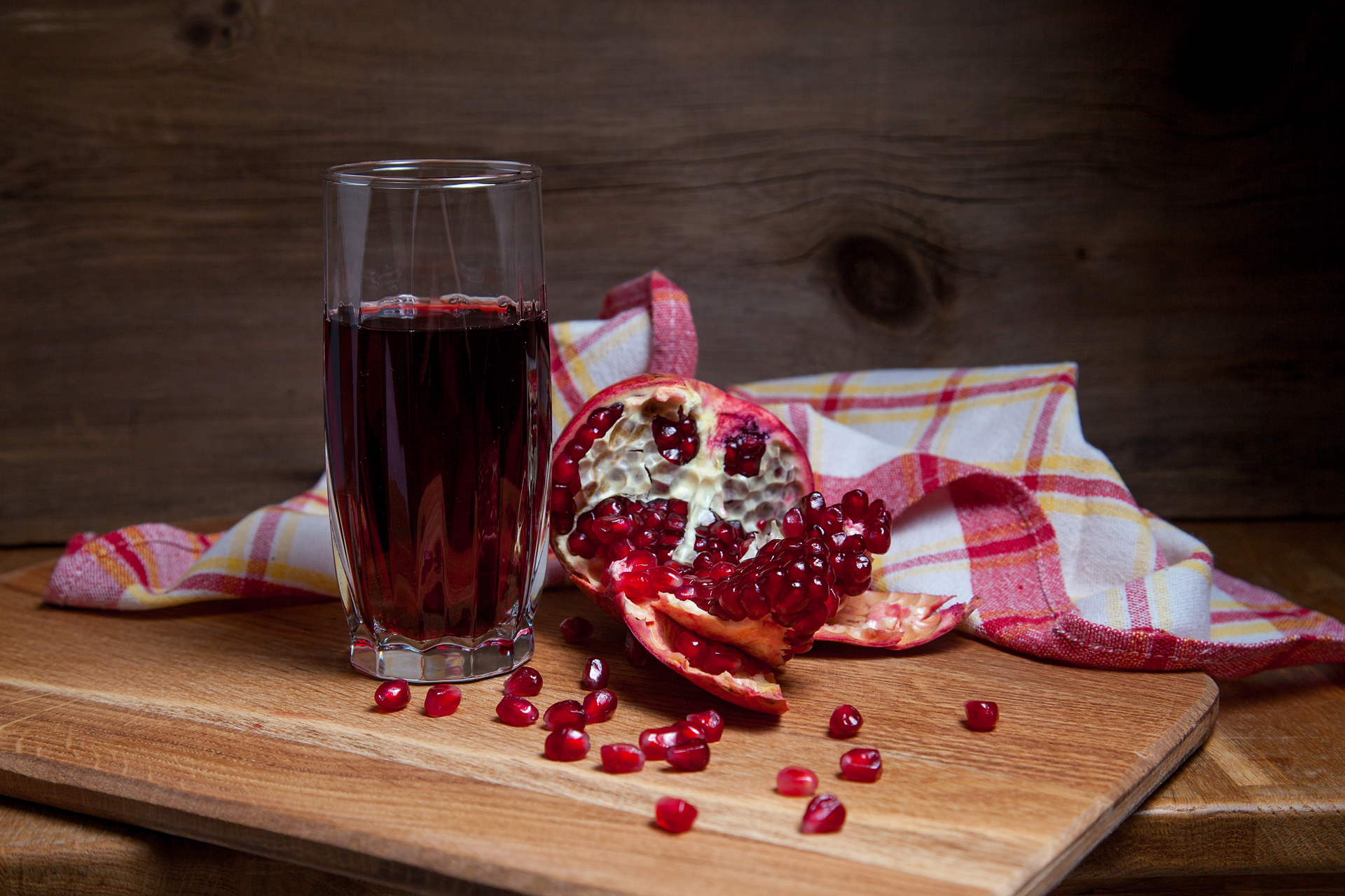 Overhead flat-lay of all ingredients for Refreshing Persian Sumac Spritzer with Pomegranate Juice laid out on a kitchen surface.