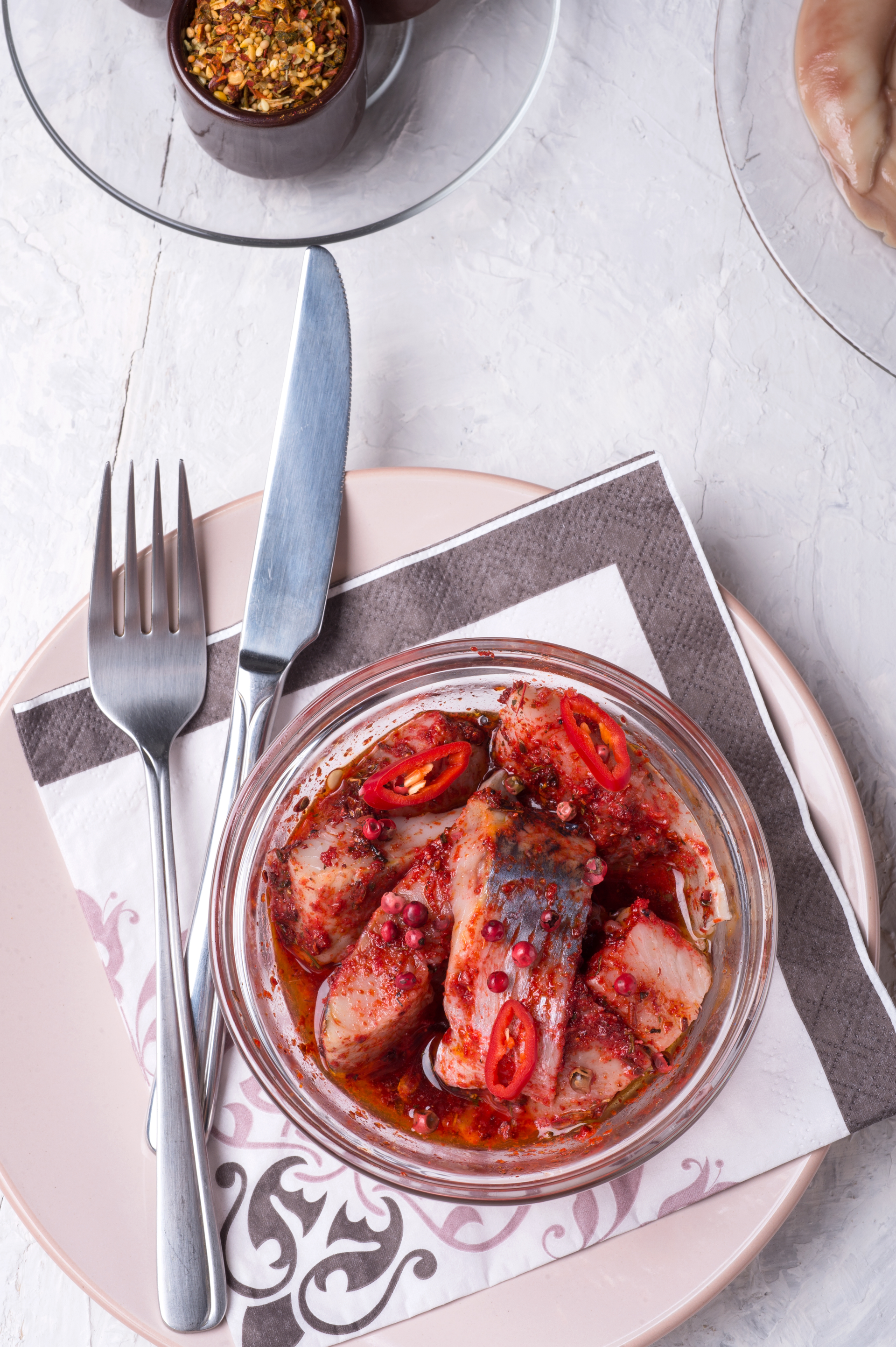 Overhead flat-lay of all ingredients for Rich Hungarian Lecso with Smoked Sausages and Paprika laid out on a kitchen surface.