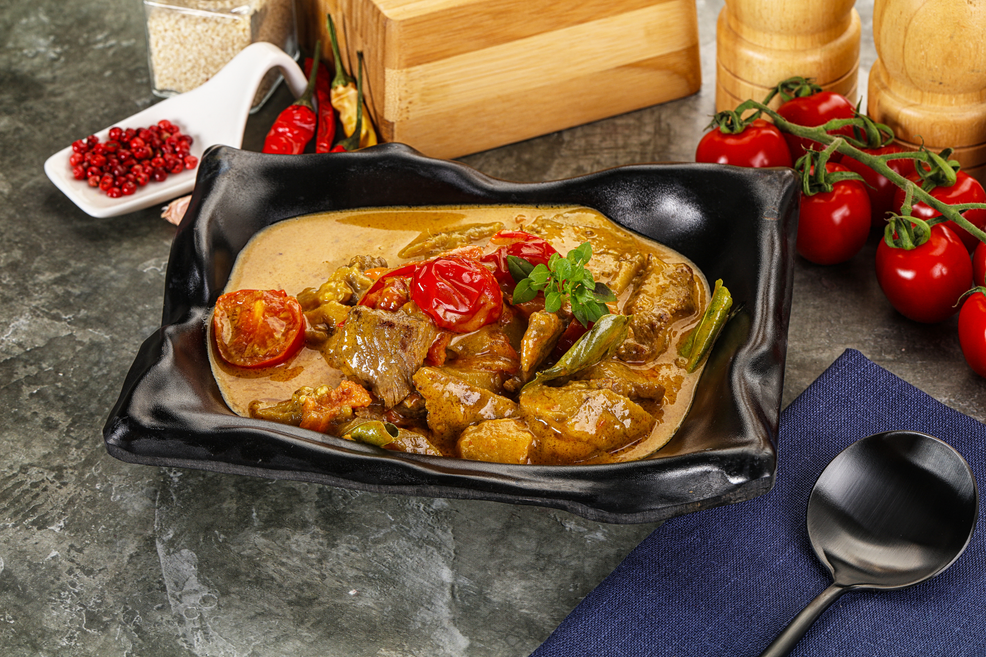 Overhead flat-lay of all ingredients for Rich Malaysian Rendang Ayam laid out on a kitchen surface.