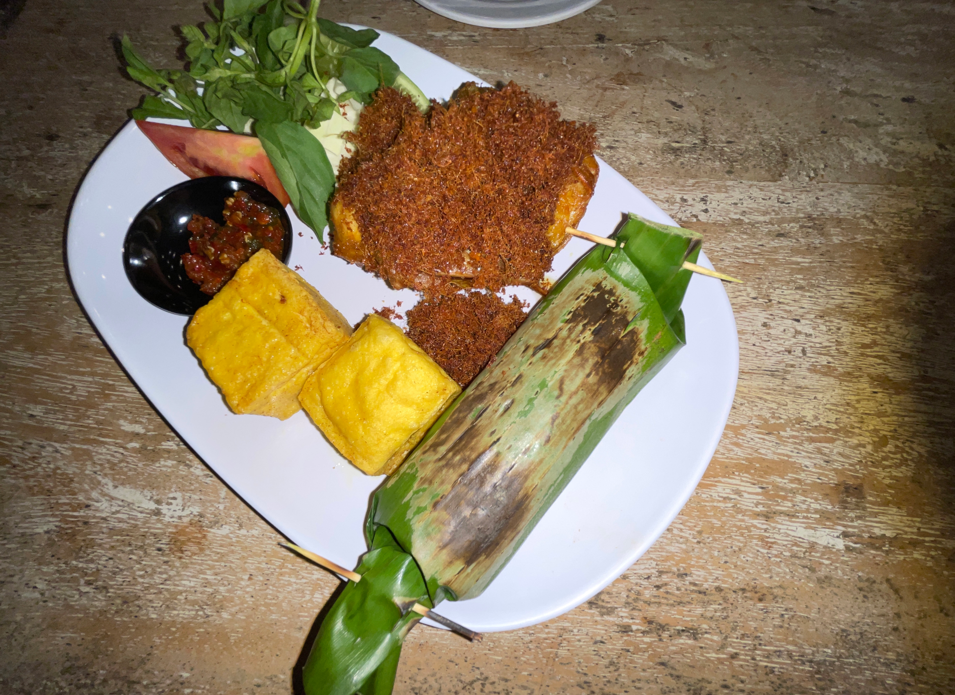 Overhead flat-lay of all ingredients for Rich Venezuelan Hallacas with Plantain Leaves laid out on a kitchen surface.