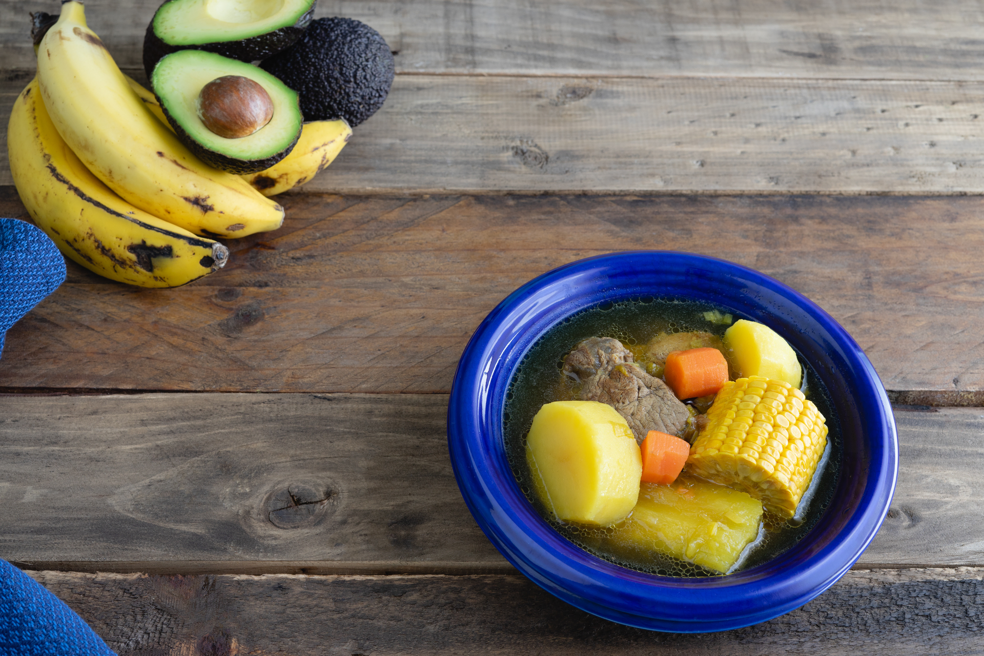 Rustic Colombian Bandeja Paisa with Plantains and Avocado — Main Course served and photographed from above