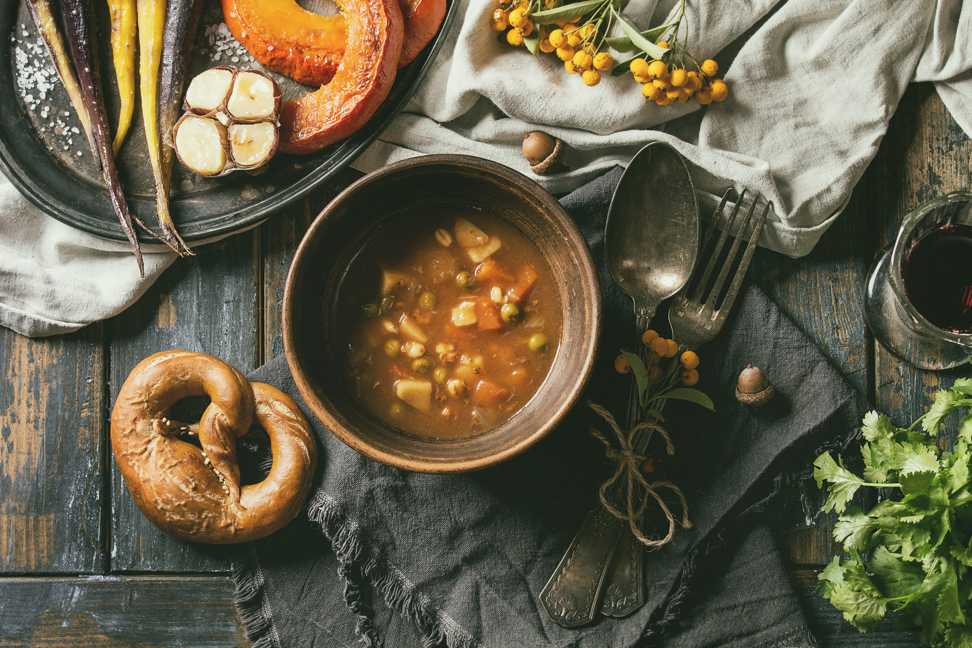Overhead flat-lay of all ingredients for Rustic Estonian Mulgikapsad with Barley and Pork Stew laid out on a kitchen surface.