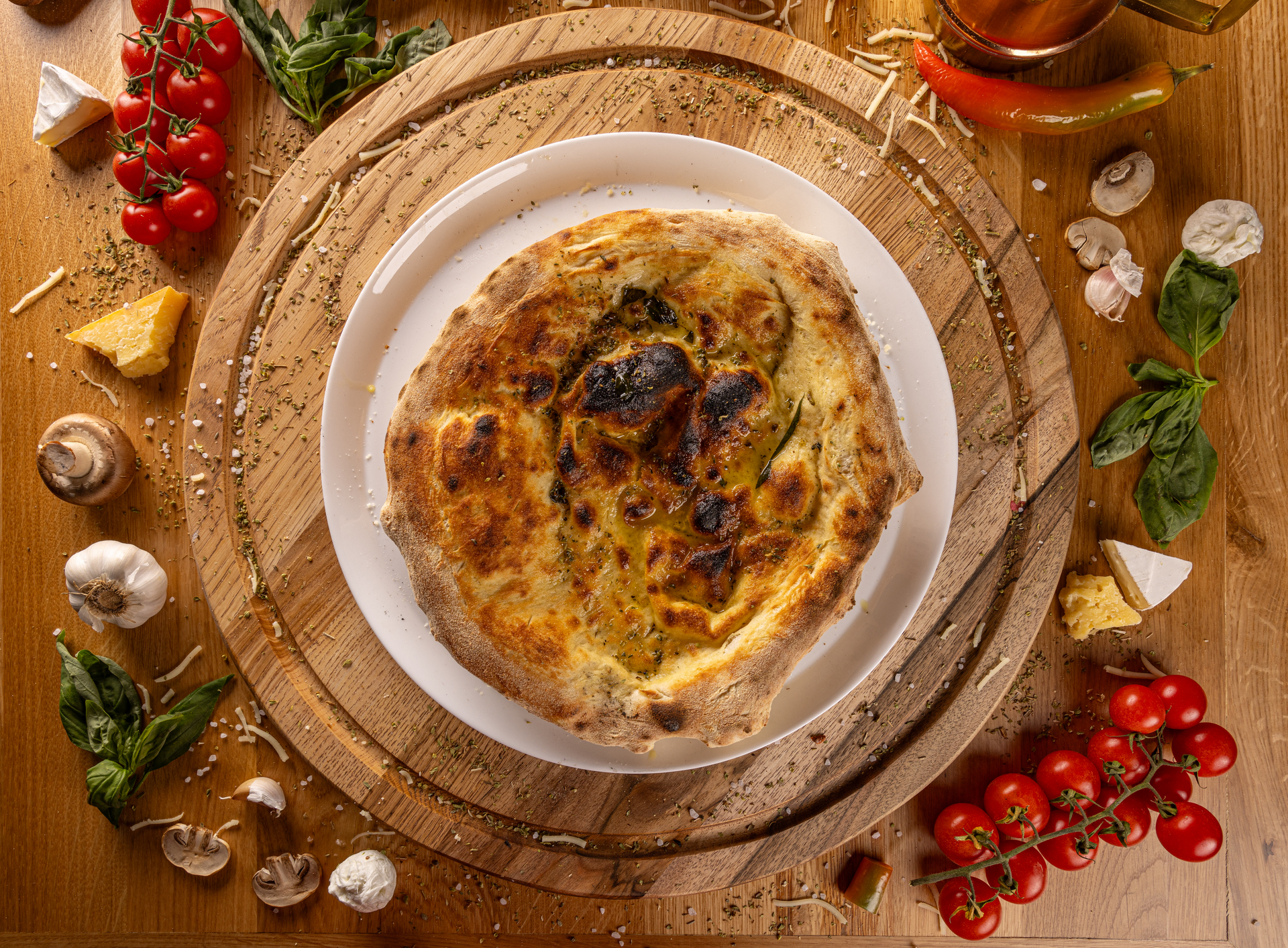 Rustic Italian Farinata with Sundried Tomato and Rosemary — Appetizer served and photographed from above