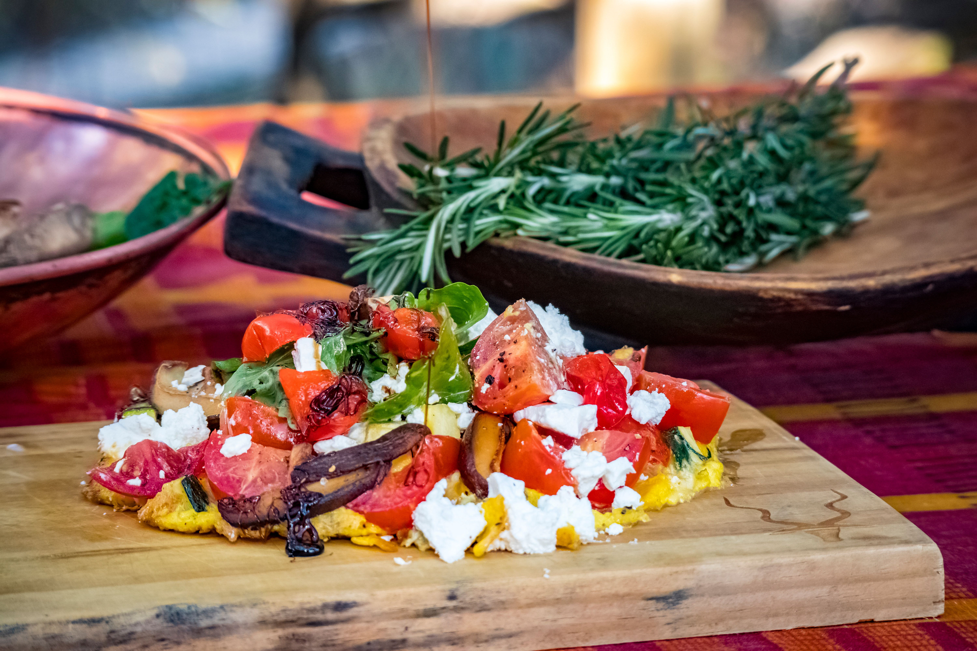 Overhead flat-lay of all ingredients for Rustic Italian Panzanella with Heirloom Tomatoes and Basil laid out on a kitchen surface.