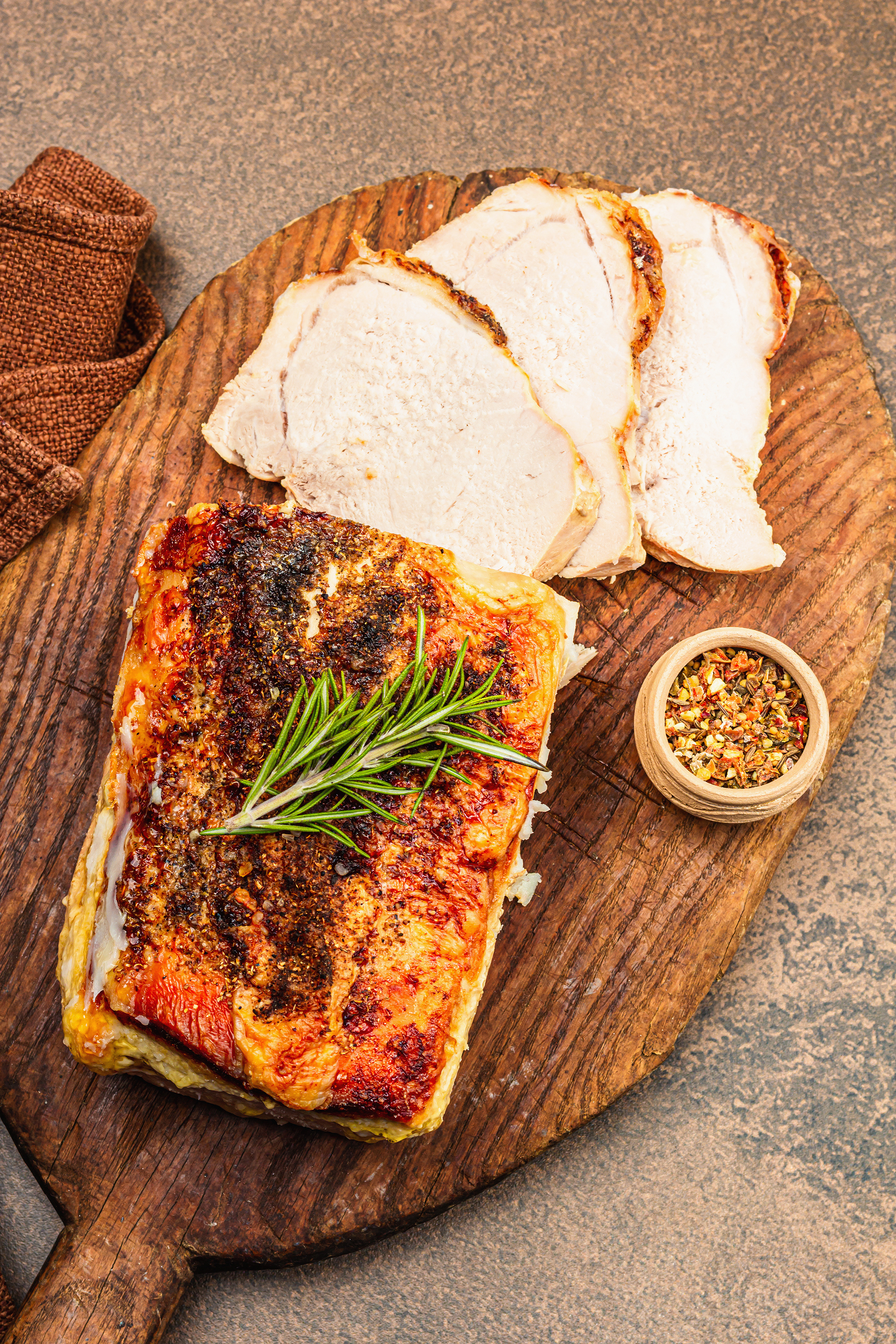 Overhead flat-lay of all ingredients for Rustic Italian Porchetta with Herb-Infused Crackling Crust laid out on a kitchen surface.