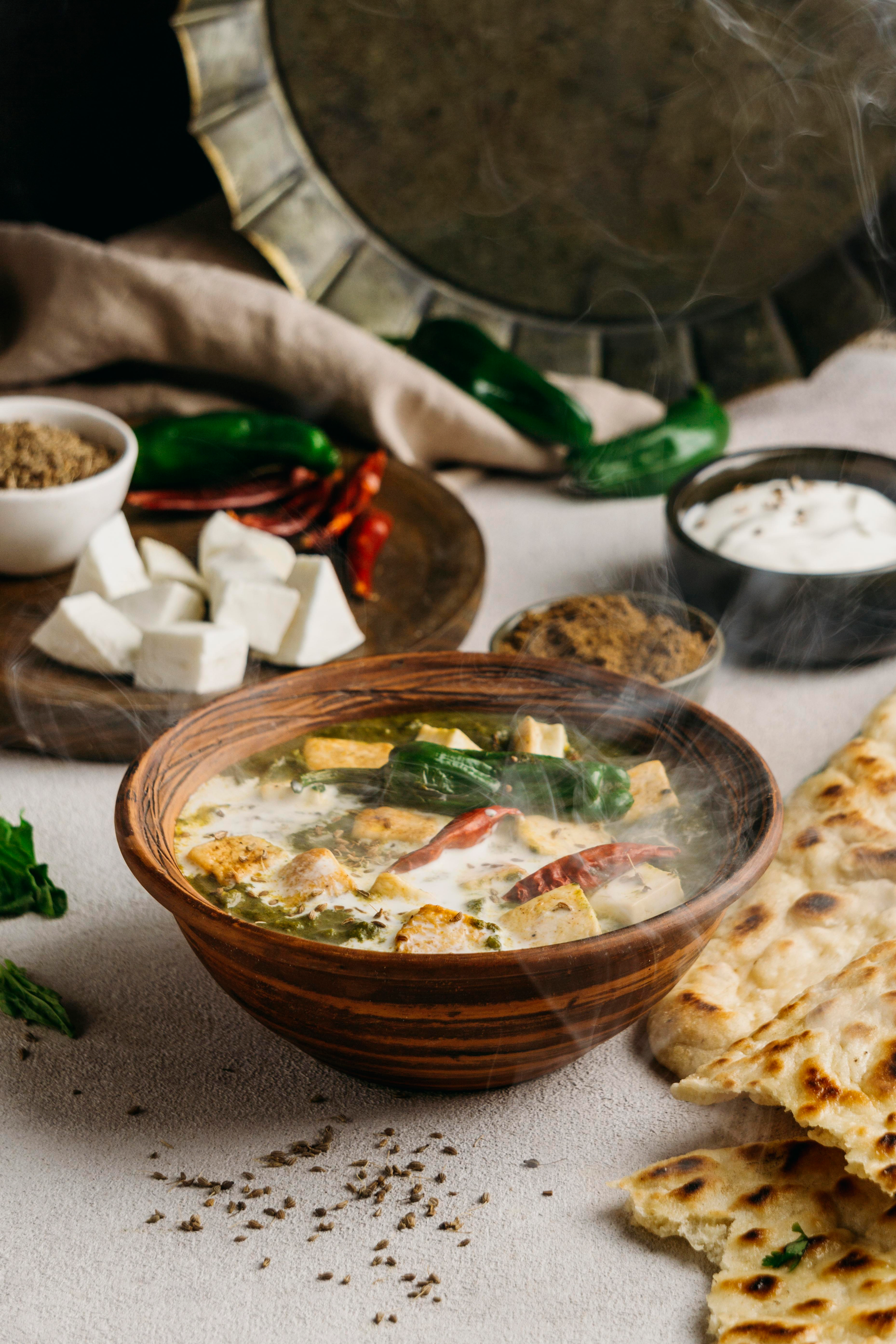 Overhead flat-lay of all ingredients for Rustic Moroccan Lamb Harira with Saffron and Chickpeas laid out on a kitchen surface.