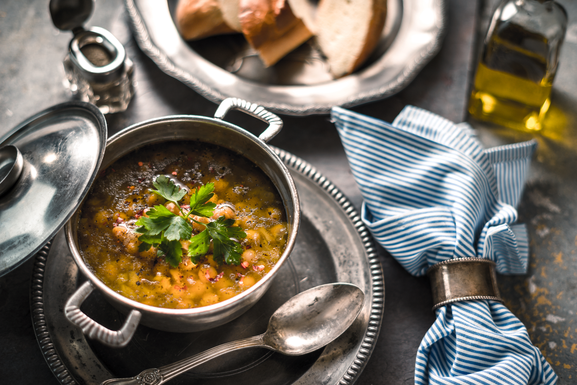 Overhead flat-lay of all ingredients for Rustic Moroccan Lentil Stew with Preserved Lemons laid out on a kitchen surface.