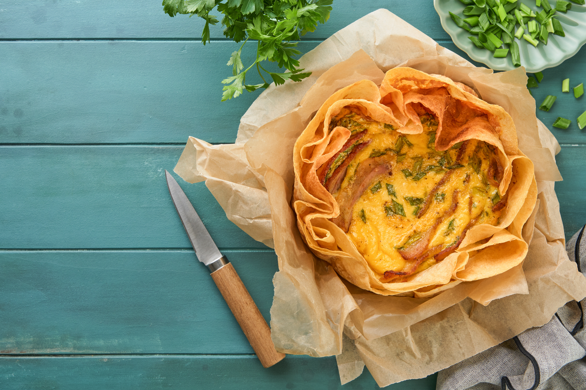 Overhead flat-lay of all ingredients for Rustic Moroccan Vegetable Pastilla with Phyllo Crust laid out on a kitchen surface.