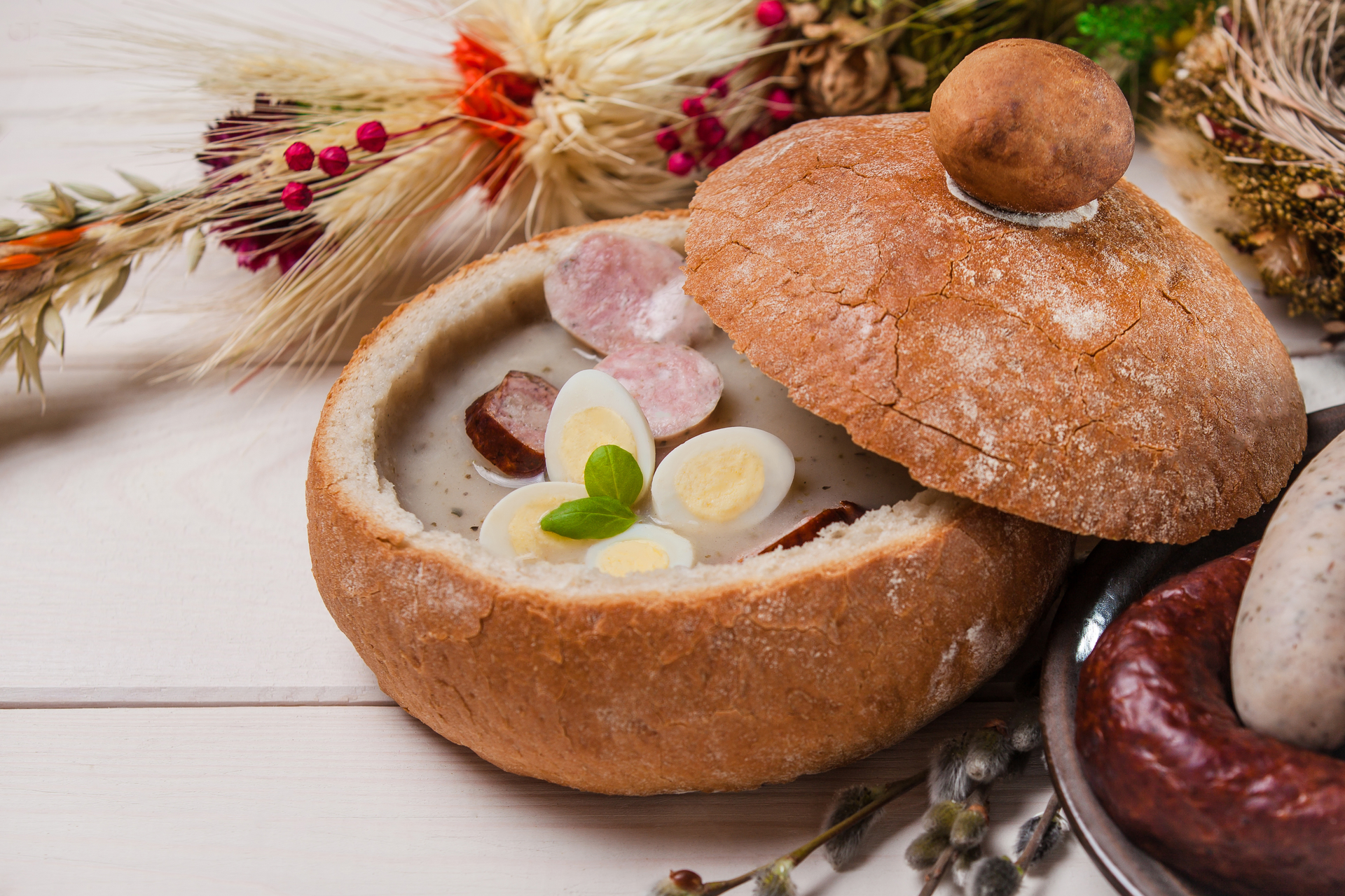 Rustic Polish Żurek with Sourdough and Sausages — Soup served and photographed from above
