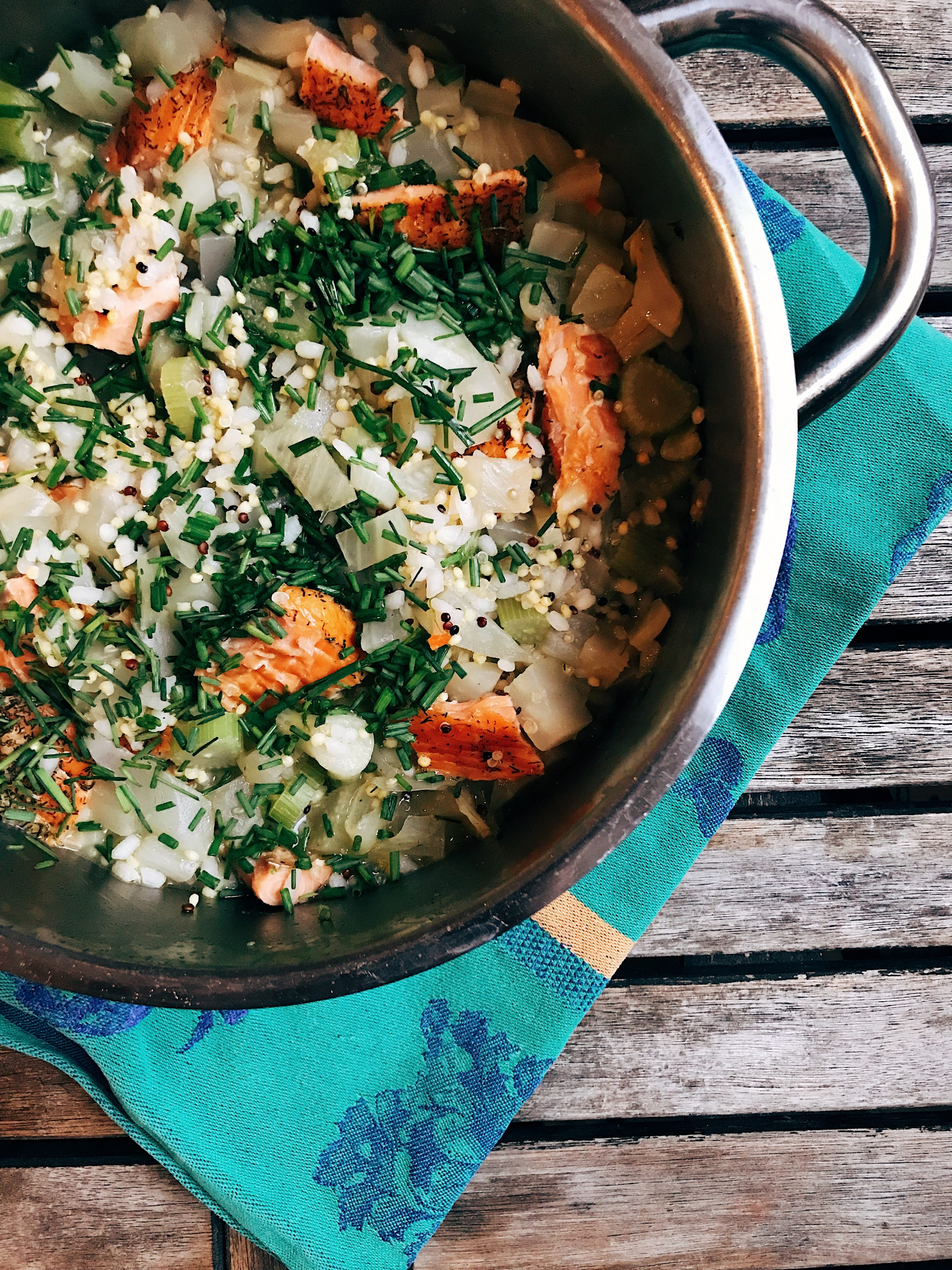 Overhead flat-lay of all ingredients for Rustic Portuguese Arroz de Marisco with Garlic and Herbs laid out on a kitchen surface.