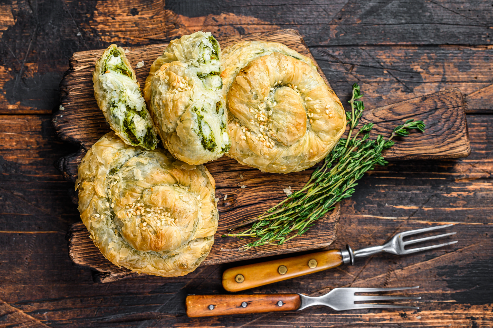 Overhead flat-lay of all ingredients for Rustic Portuguese Bolinhos de Bacalhau with Parsley laid out on a kitchen surface.