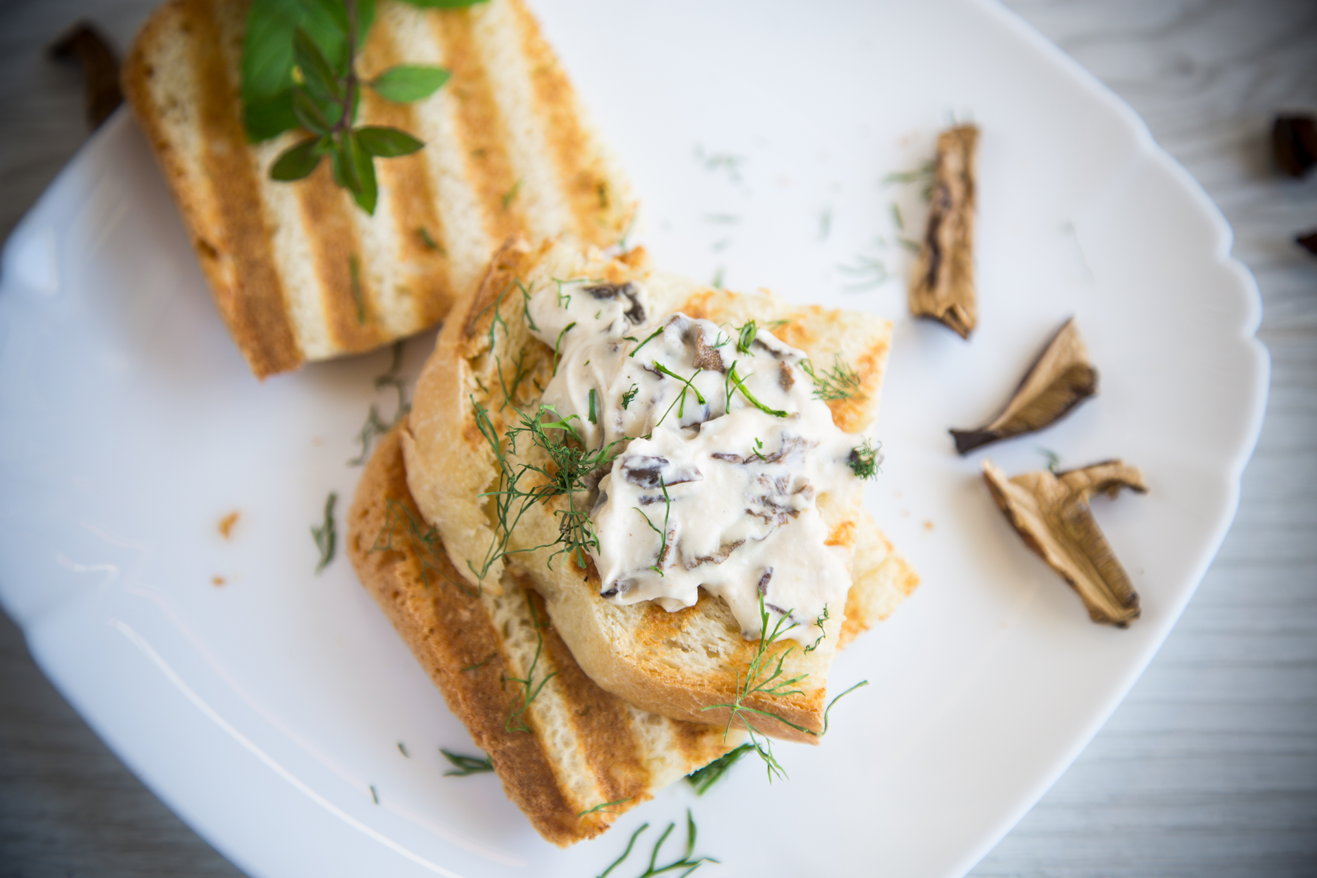 Overhead flat-lay of all ingredients for Rustic Swedish Jansson's Temptation with Anchovies and Cream laid out on a kitchen surface.