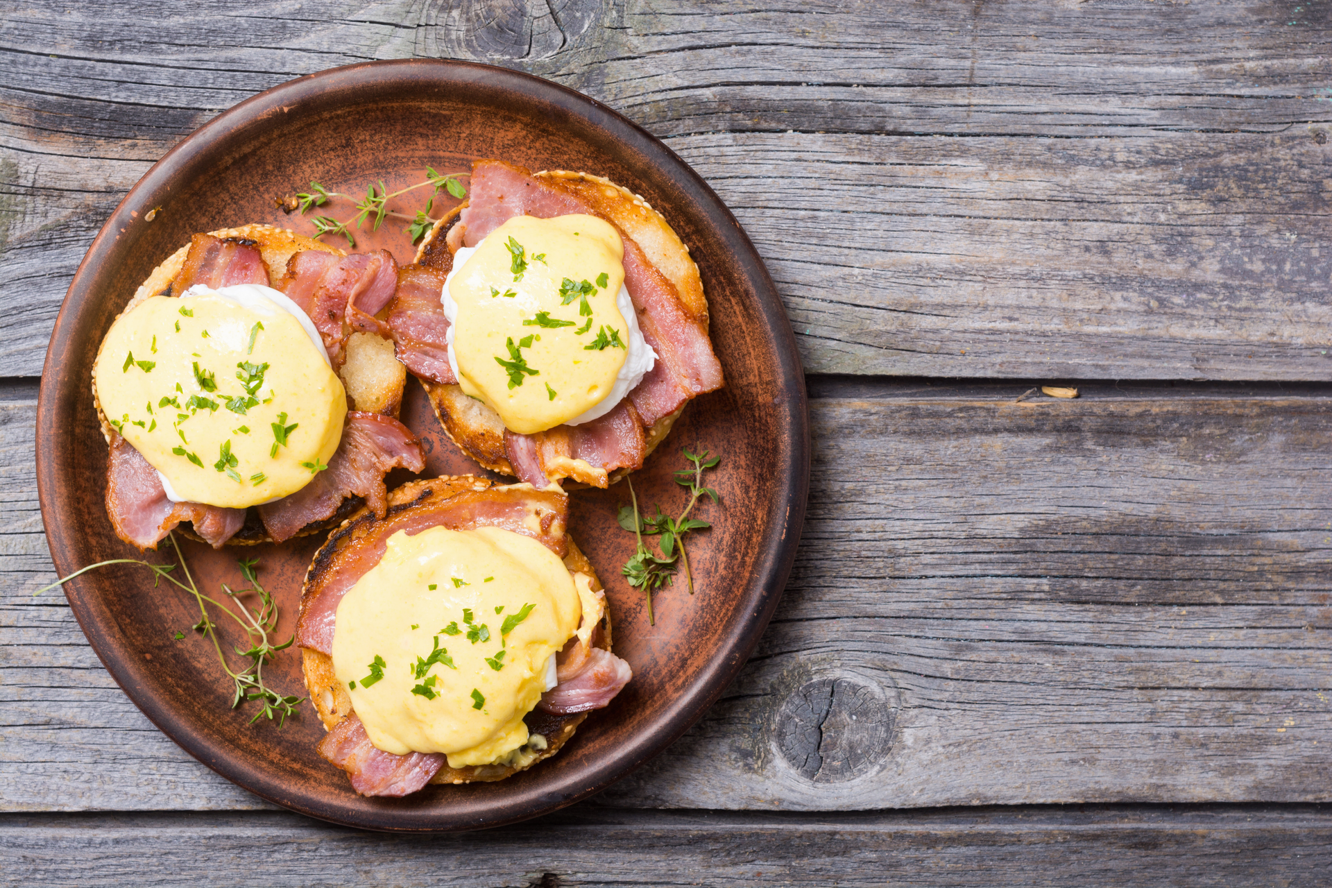 Overhead flat-lay of all ingredients for Rustic Swiss Rösti with Raclette Cheese and Ham laid out on a kitchen surface.