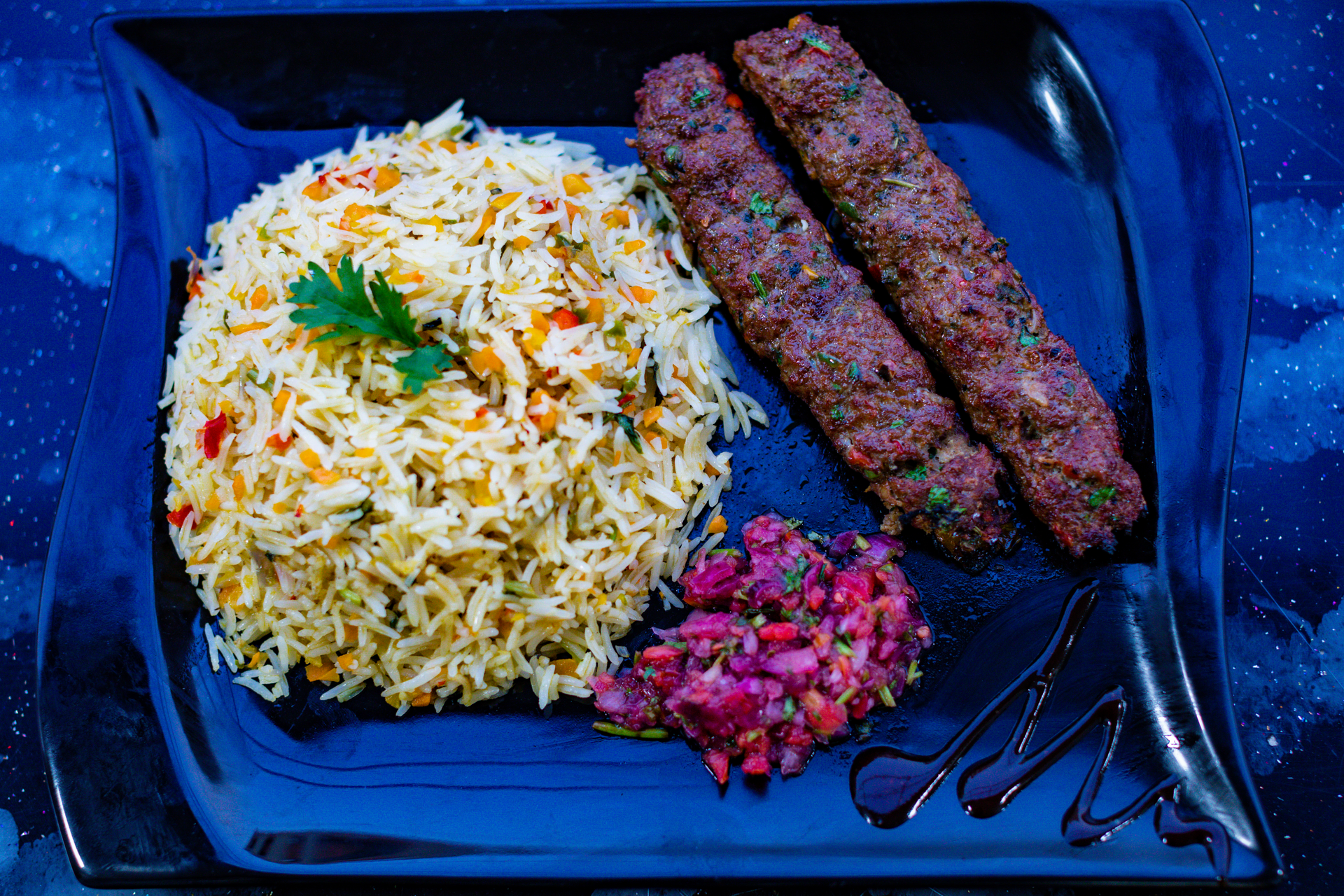 Overhead flat-lay of all ingredients for Saffron-Infused Iranian Kebab with Rice and Barberry laid out on a kitchen surface.