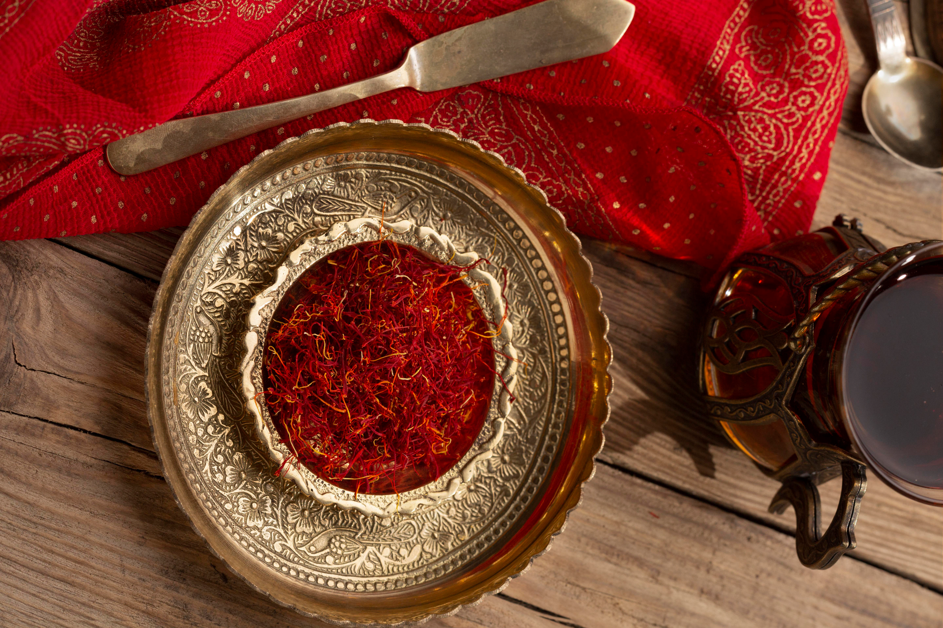Overhead flat-lay of all ingredients for Saffron-Infused Persian Tahchin with Barberries laid out on a kitchen surface.