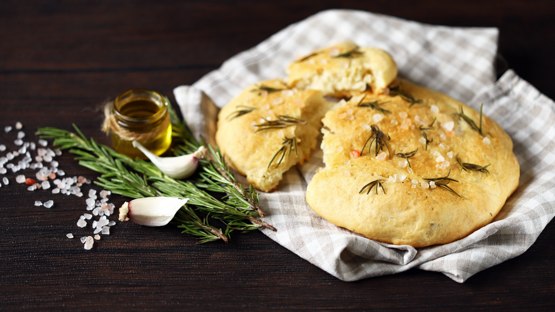 Overhead flat-lay of all ingredients for Savory Australian Damper with Rosemary and Olive Oil laid out on a kitchen surface.
