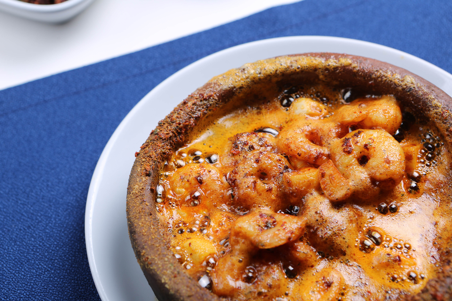 Overhead flat-lay of all ingredients for Savory Brazilian Acarajé with Vatapá and Crab Filling laid out on a kitchen surface.