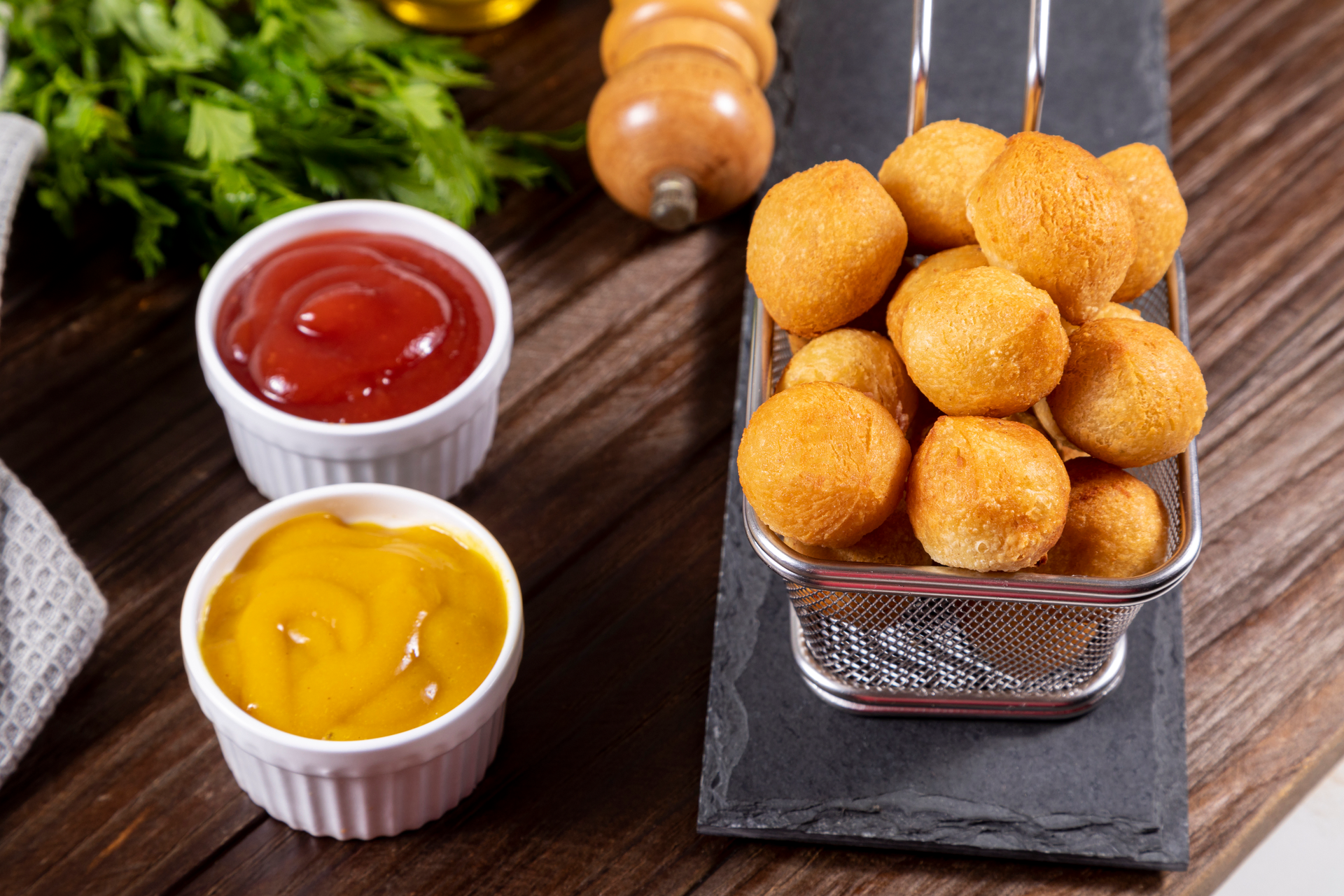 Overhead flat-lay of all ingredients for Savory Dutch Bitterballen with Mustard Dip laid out on a kitchen surface.