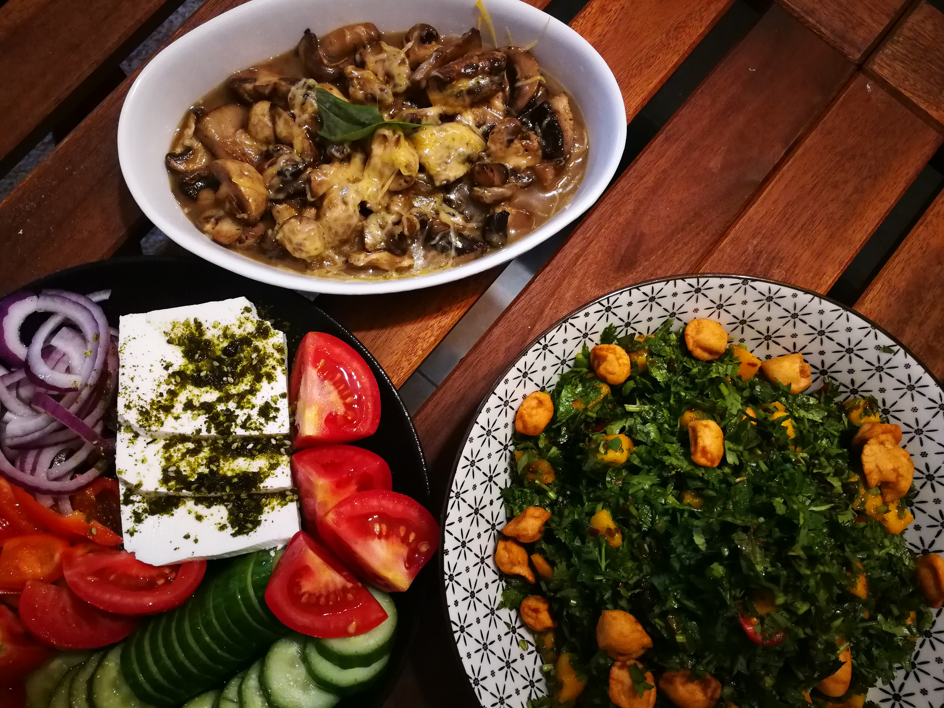 Overhead flat-lay of all ingredients for Savory Egyptian Kebda Iskandarani laid out on a kitchen surface.