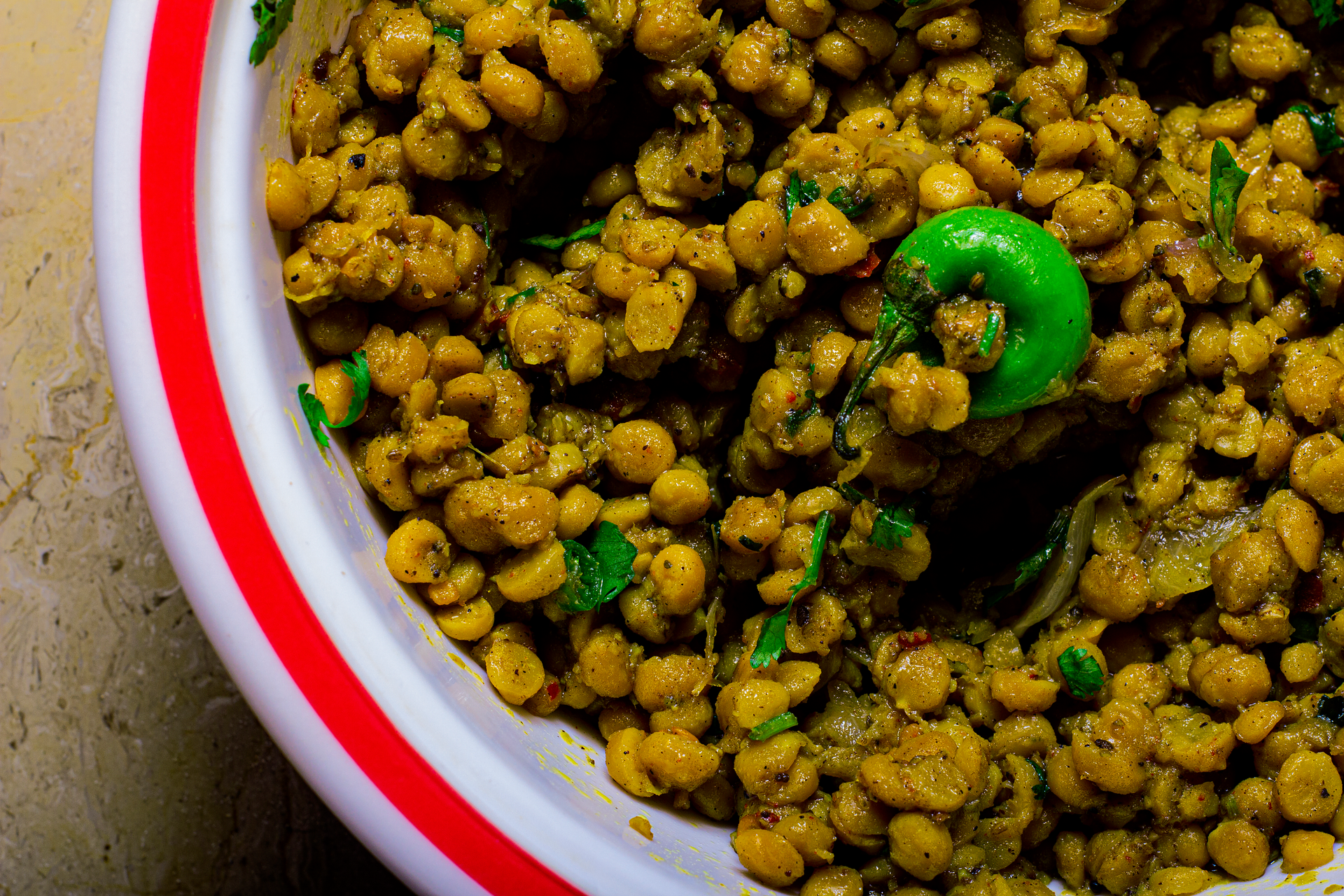 Overhead flat-lay of all ingredients for Savory Ethiopian Alicha Wot with Split Peas and Turmeric laid out on a kitchen surface.