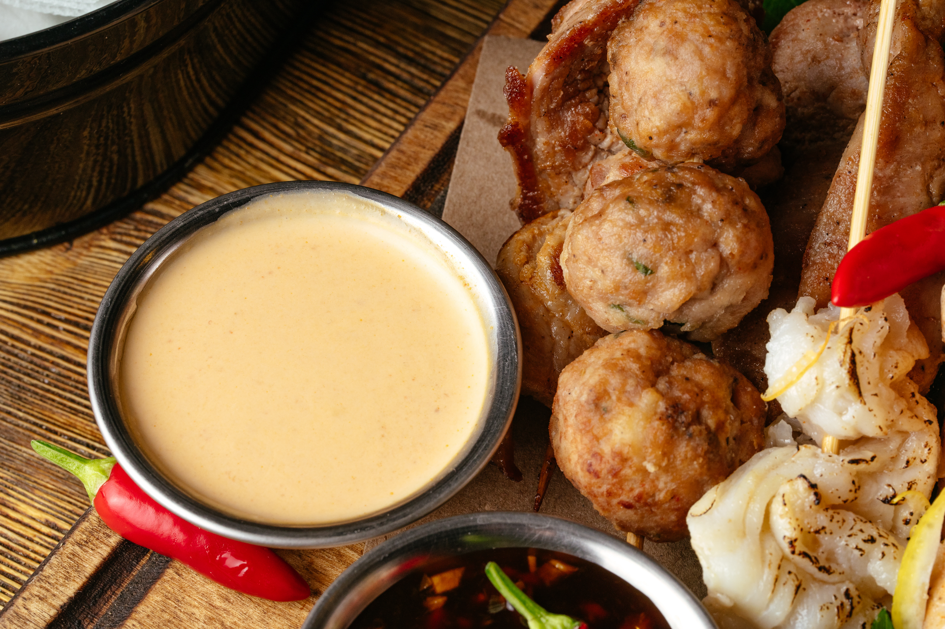 Overhead flat-lay of all ingredients for Savory Filipino Longganisa Sliders with Garlic Vinegar Dip laid out on a kitchen surface.