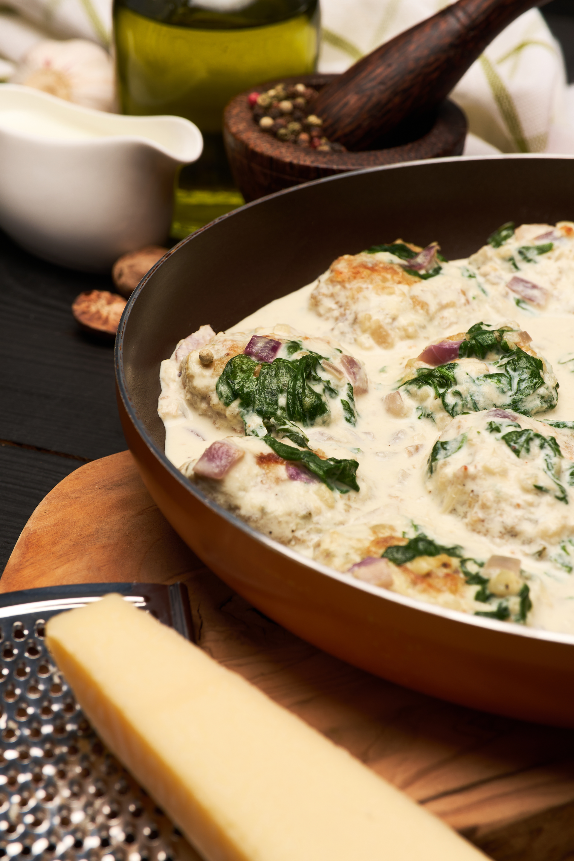Overhead flat-lay of all ingredients for Savory Greek Moussaka with Fresh Mint and Béchamel Sauce laid out on a kitchen surface.