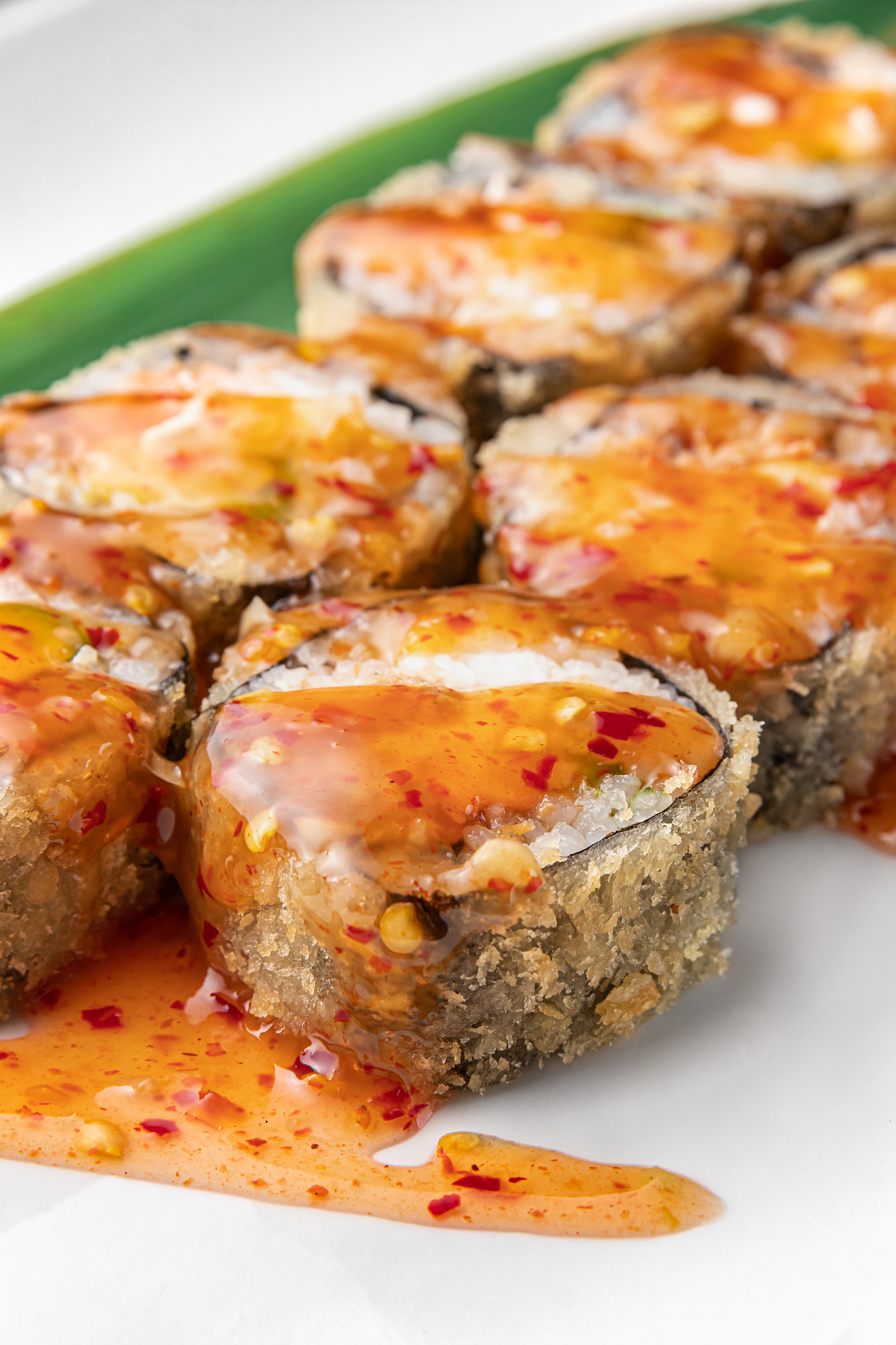 Overhead flat-lay of all ingredients for Savory Jamaican Ackee Roll-Ups with Saltfish and Scotch Bonnet Drizzle laid out on a kitchen surface.