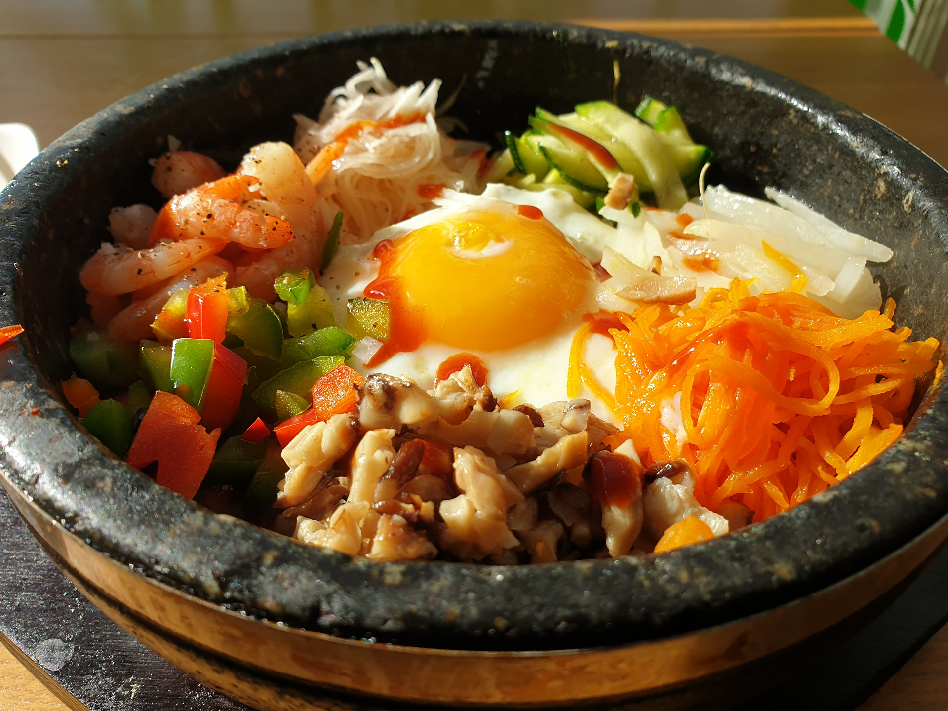 Overhead flat-lay of all ingredients for Savory Korean Bibimbap Sampler with Quail Eggs and Chili Threads laid out on a kitchen surface.