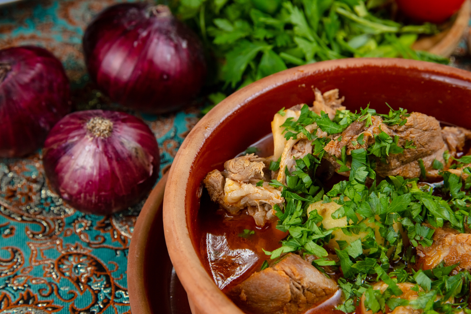 Overhead flat-lay of all ingredients for Savory Pakistani Nihari with Ginger-Garlic Garnish laid out on a kitchen surface.