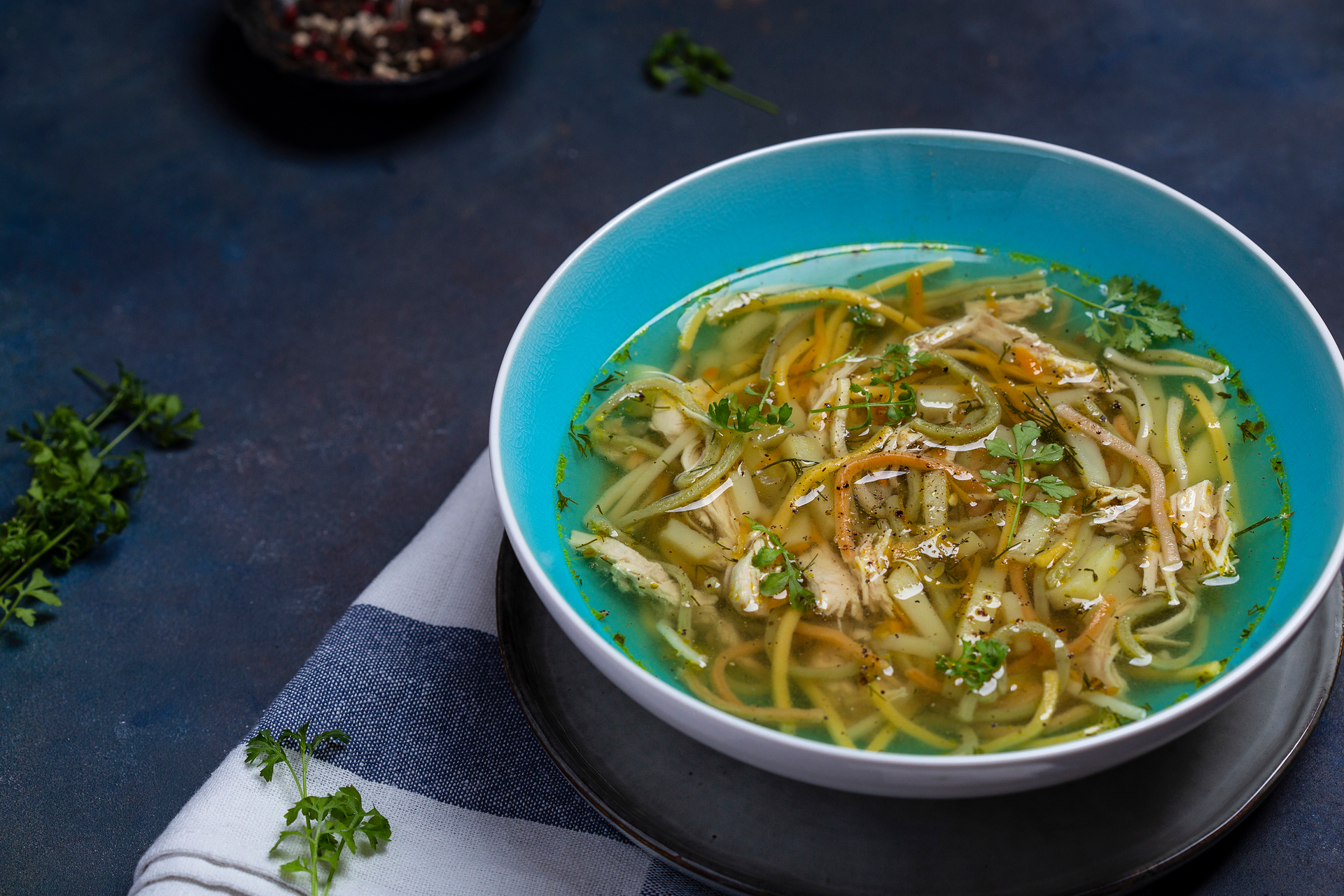Overhead flat-lay of all ingredients for Savory Tibetan Thenthuk with Spinach and Mint Broth laid out on a kitchen surface.