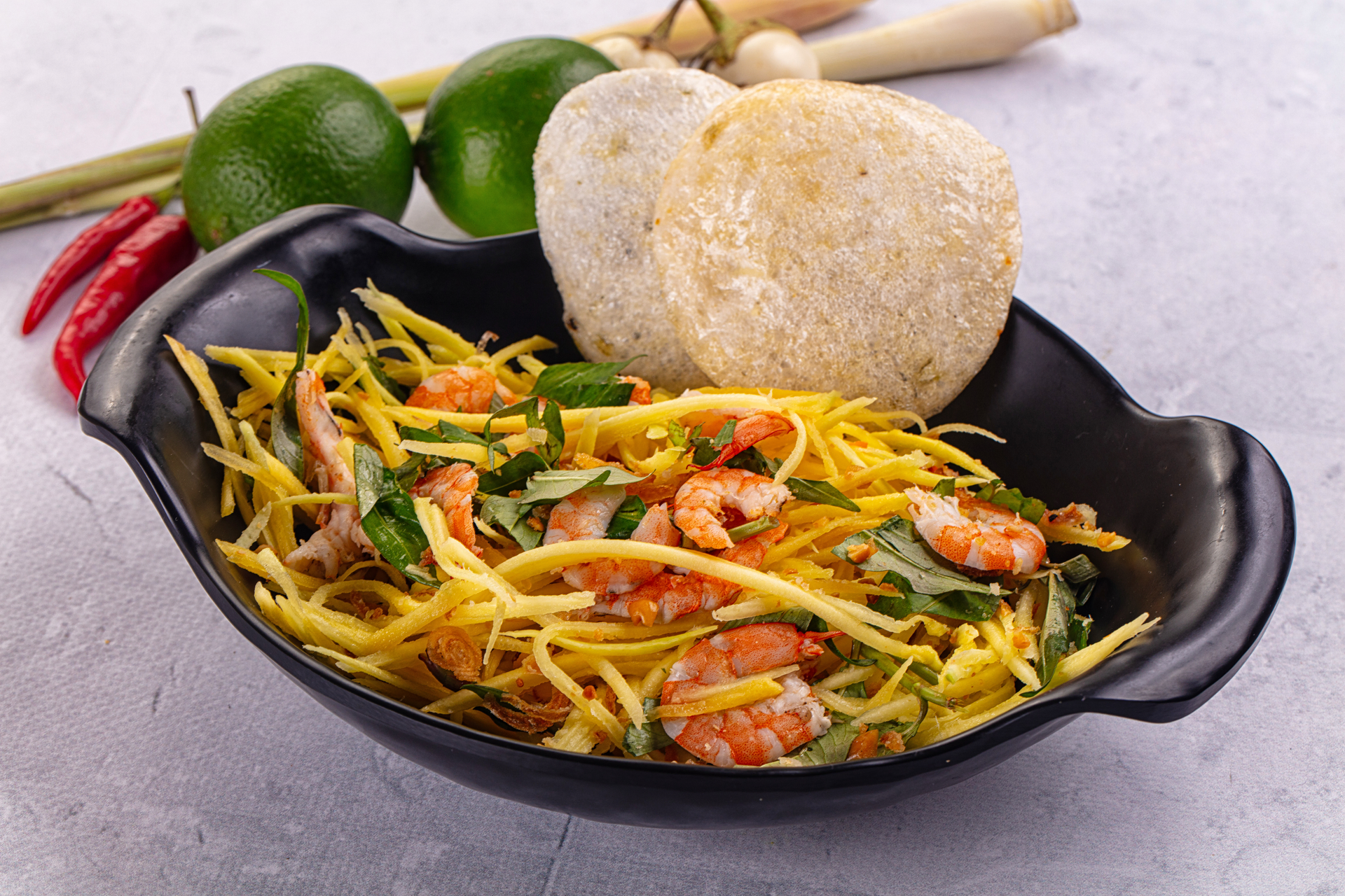 Overhead flat-lay of all ingredients for Savory Vietnamese Banh Xeo with Shrimp and Bean Sprouts laid out on a kitchen surface.