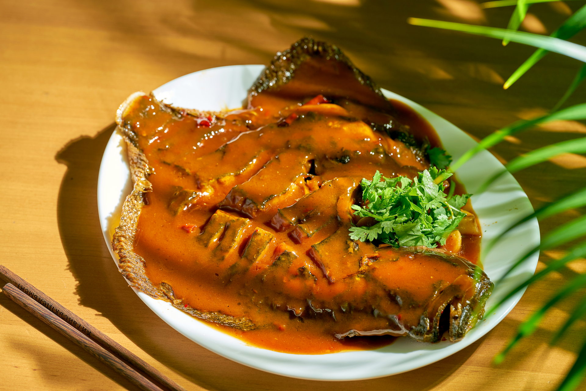Overhead flat-lay of all ingredients for Savory Vietnamese Clay Pot Fish with Caramel Sauce laid out on a kitchen surface.